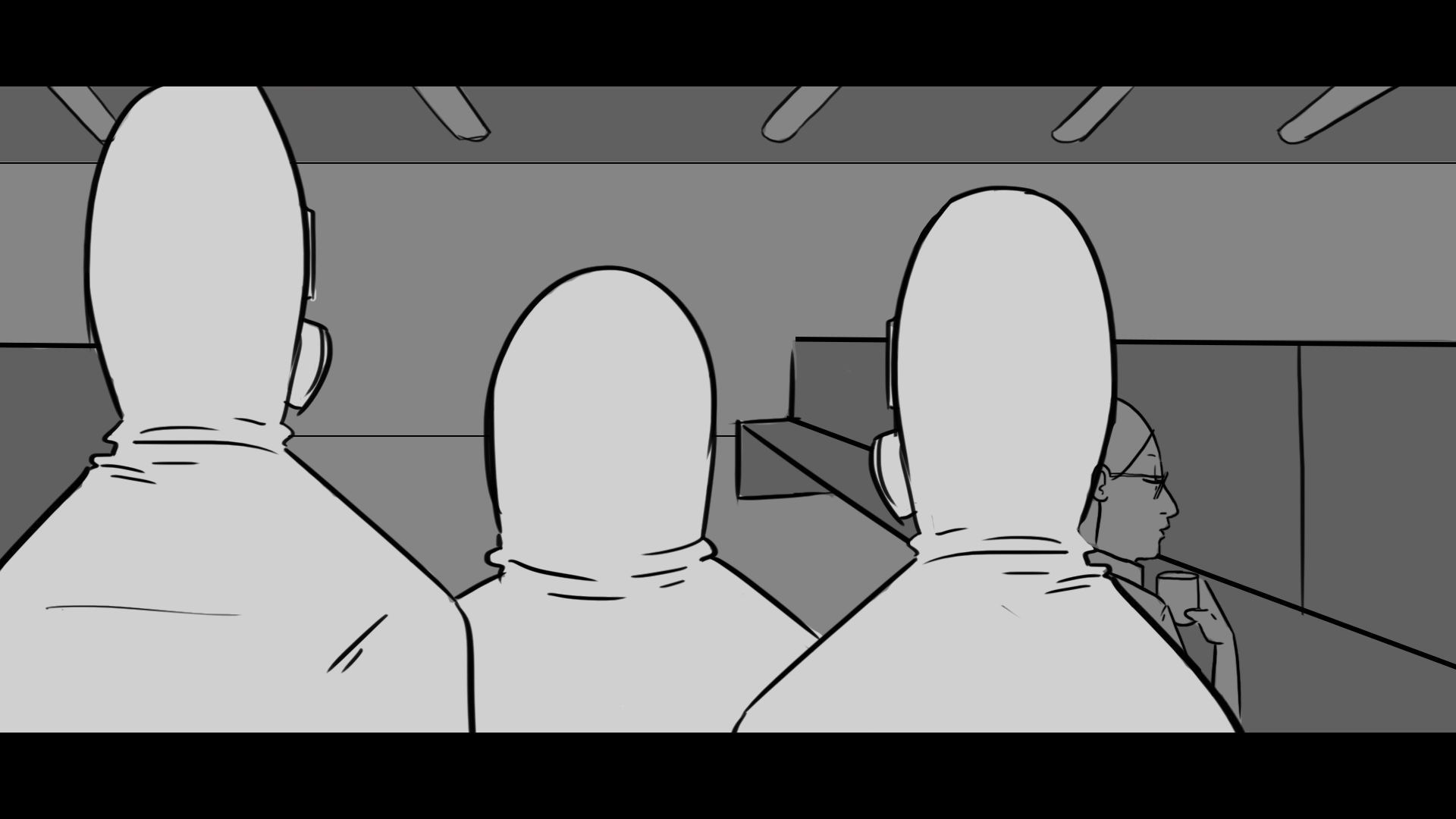 Three people with hooded sweatshirts sitting on a bench, viewed from behind, with a woman sitting separately at the right side of the image.