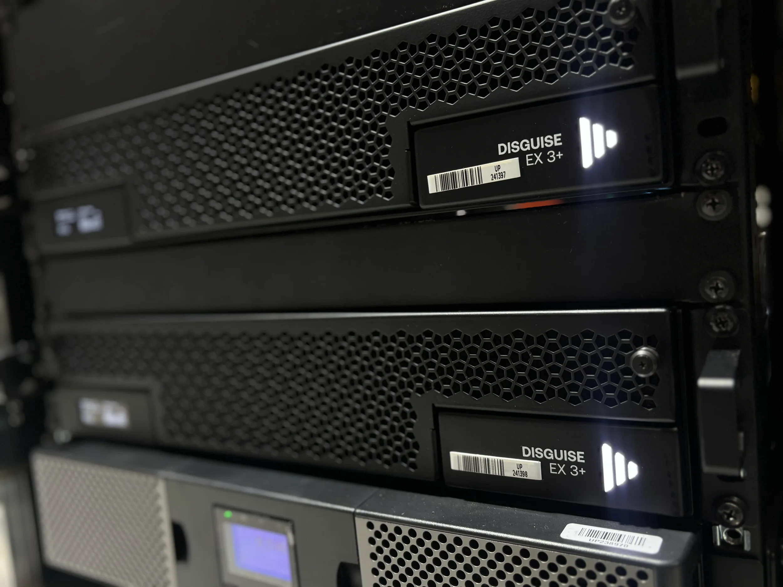 Close-up profile of rack-mounted Disguise EX 3 Plus event media servers featuring Universal Pixels inventory asset tracking barcodes.
