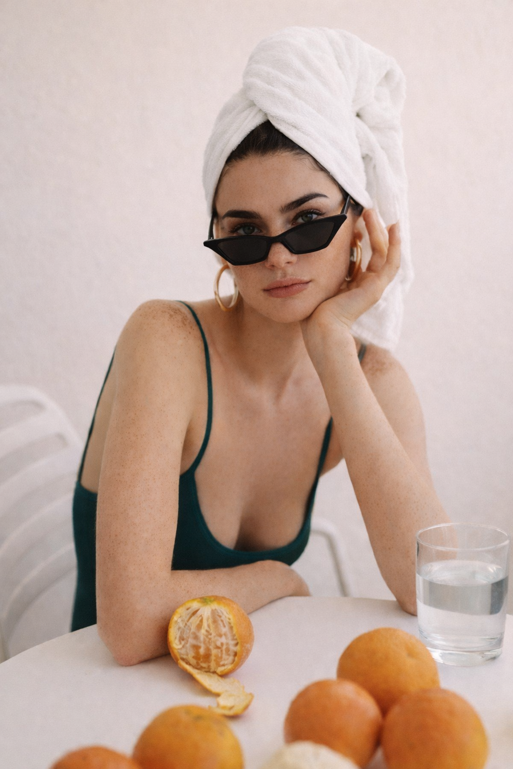 woman with oranges thinking about skincare