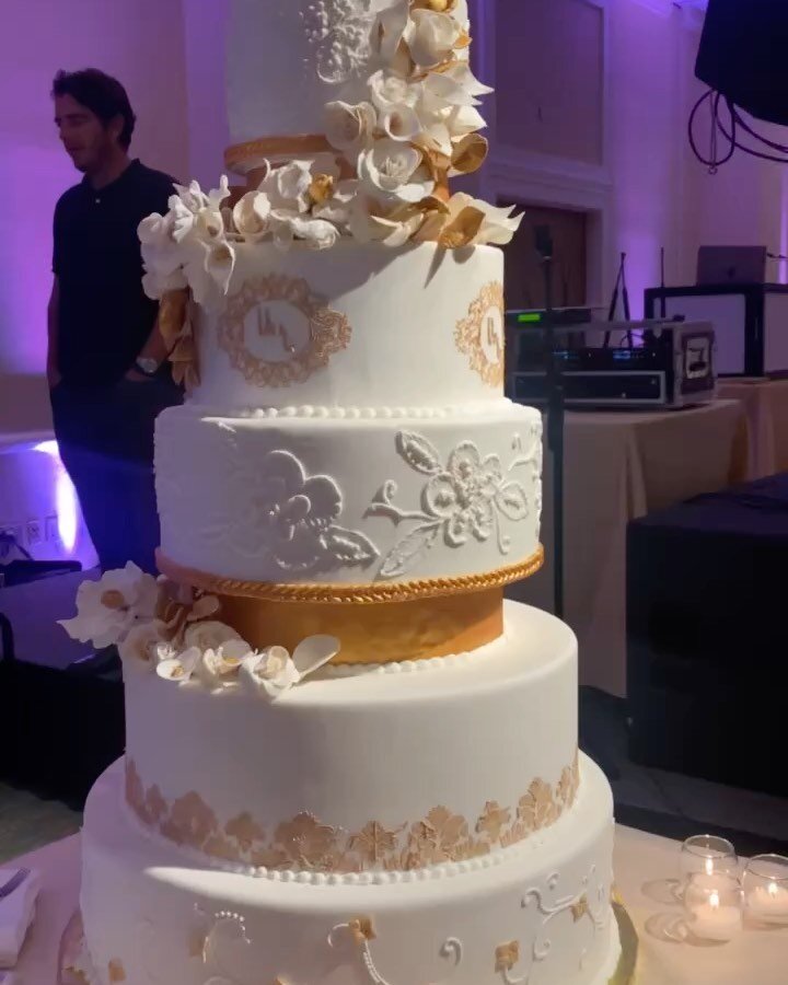 A little overdue but one of my favorite creations so far, my wedding cake! 
An 8 tier wedding cake decorated with handmade gum paste flowers with a brushed embroidery design and  touches of gold detail work. We had  his and her flavors funfetti cake 