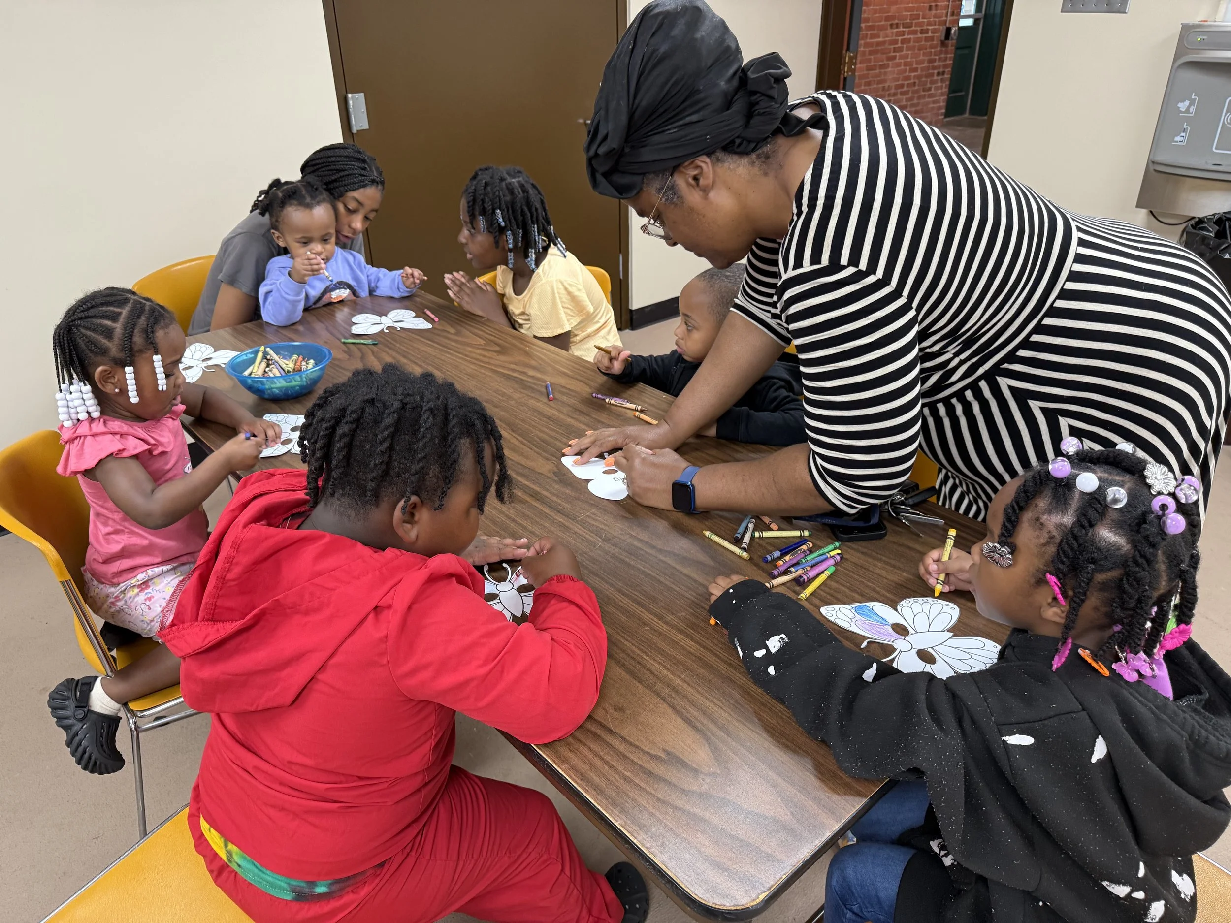 Group of children participating in an art program. 