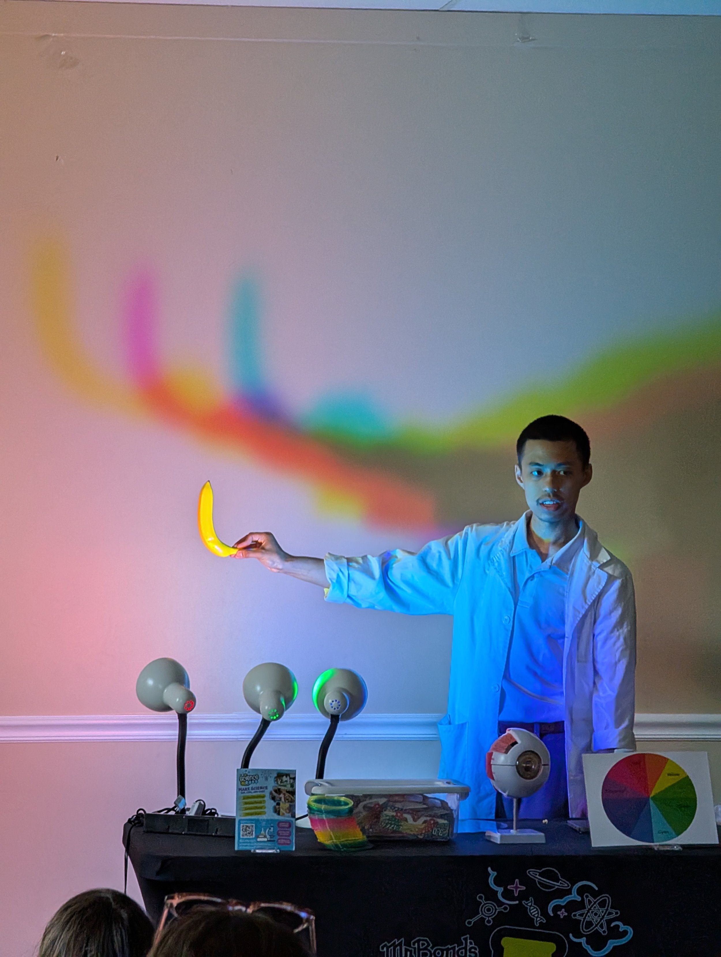 Man demonstrating a light experiment. 