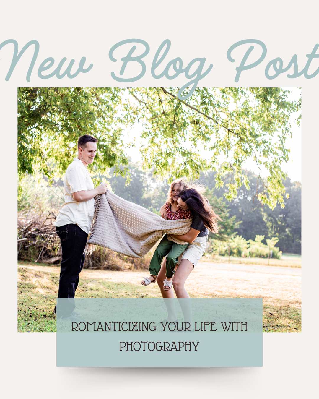 A family playing outdoors under a large tree on a sunny day, with a man holding an adult woman and a young girl, all smiling and having fun.