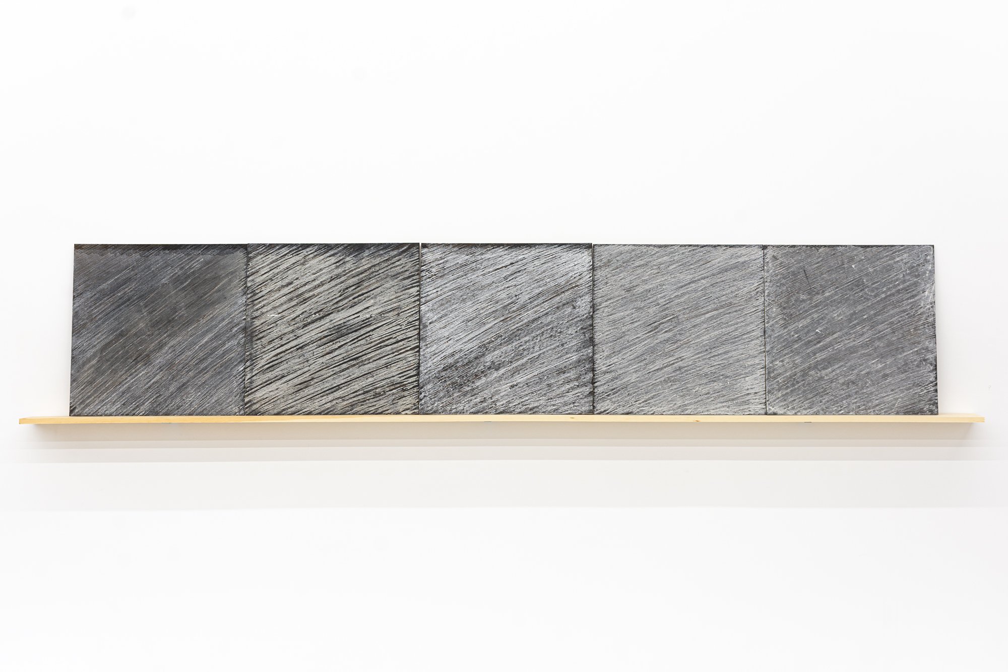 Michael Fernandes, Residue, a set of 5's, 2005. Blackboard and chalk. 24 inches x 10 ft.