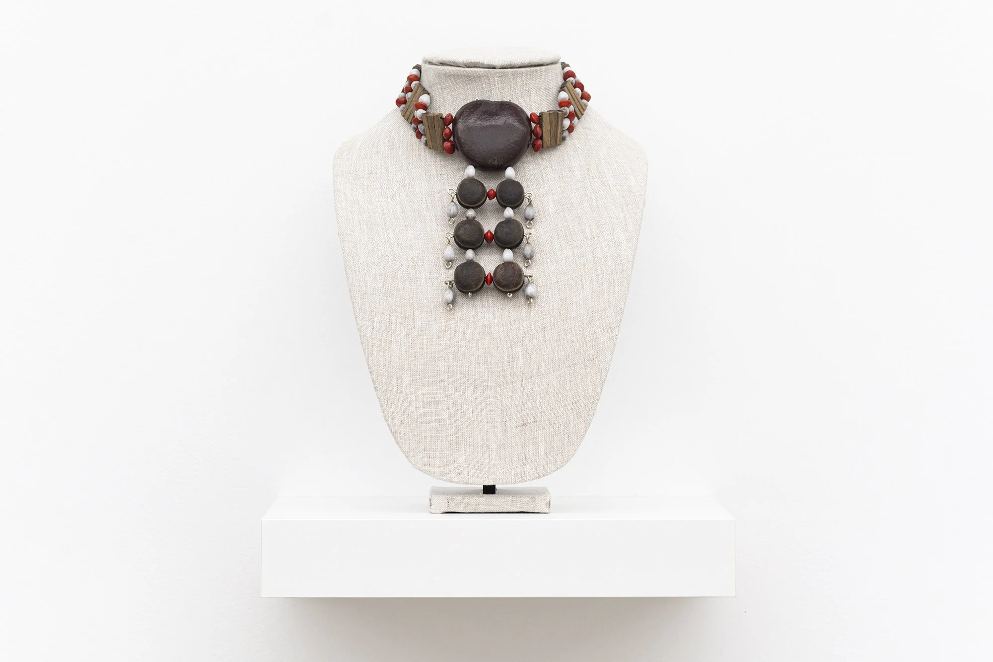 Tyshan Wright,   Carry Me   2026. Maroon beads, wire.