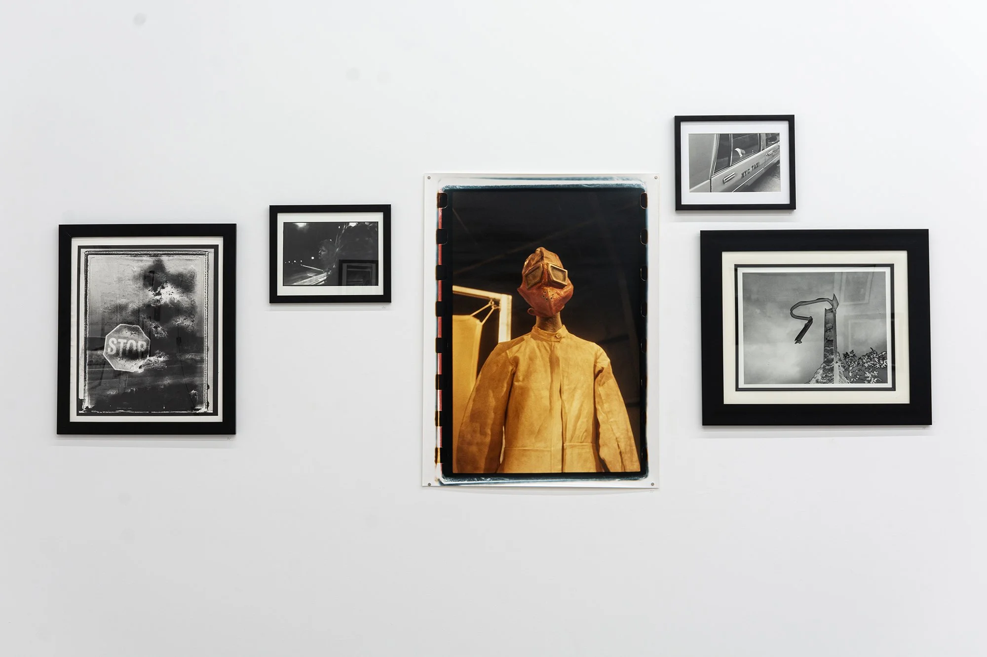Tim Brennan.  Photographs . Installation view. Centre:  Figure , 2006. Colour photograph. 76.2 x 101.6 cm.