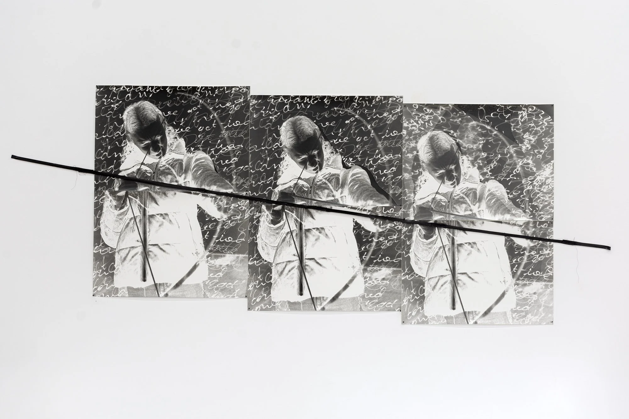 Sheilah ReStack, The Archer, 2025. RC prints, thread, rubber band. Approx. 32 x 84 inches. 