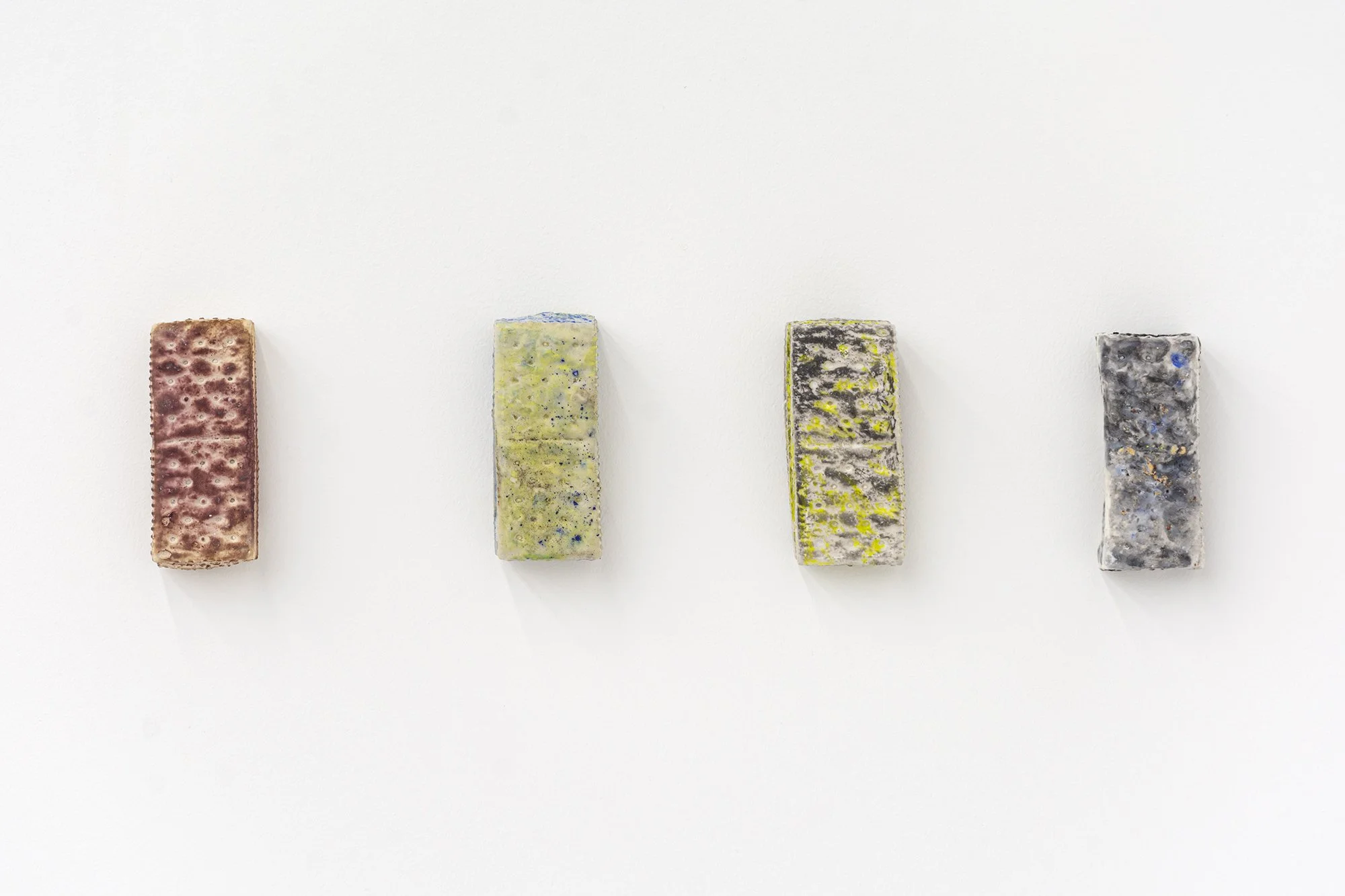 Yujia Shi, Memory Studies, 2025. Hydrocal, wax, pastel and exhausted natural dye. Approx. 4 x 2 x 1 inches each. 