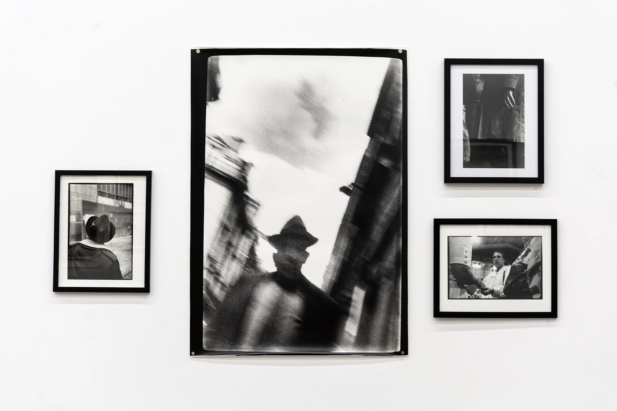 Tim Brennan.  Photographs . Installation view. Centre:  Paris , 1983. Black and white photograph. 76.2 x 101.6 cm.
