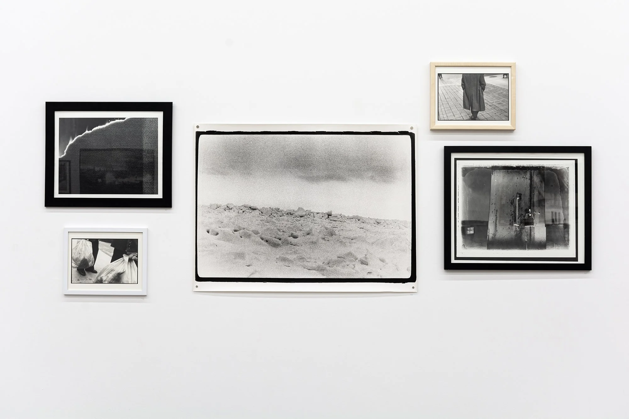 Tim Brennan.  Photographs . Installation view. Centre:  Big Ice , 2000. Black and white photograph. 101.6 x 76.2 cm.