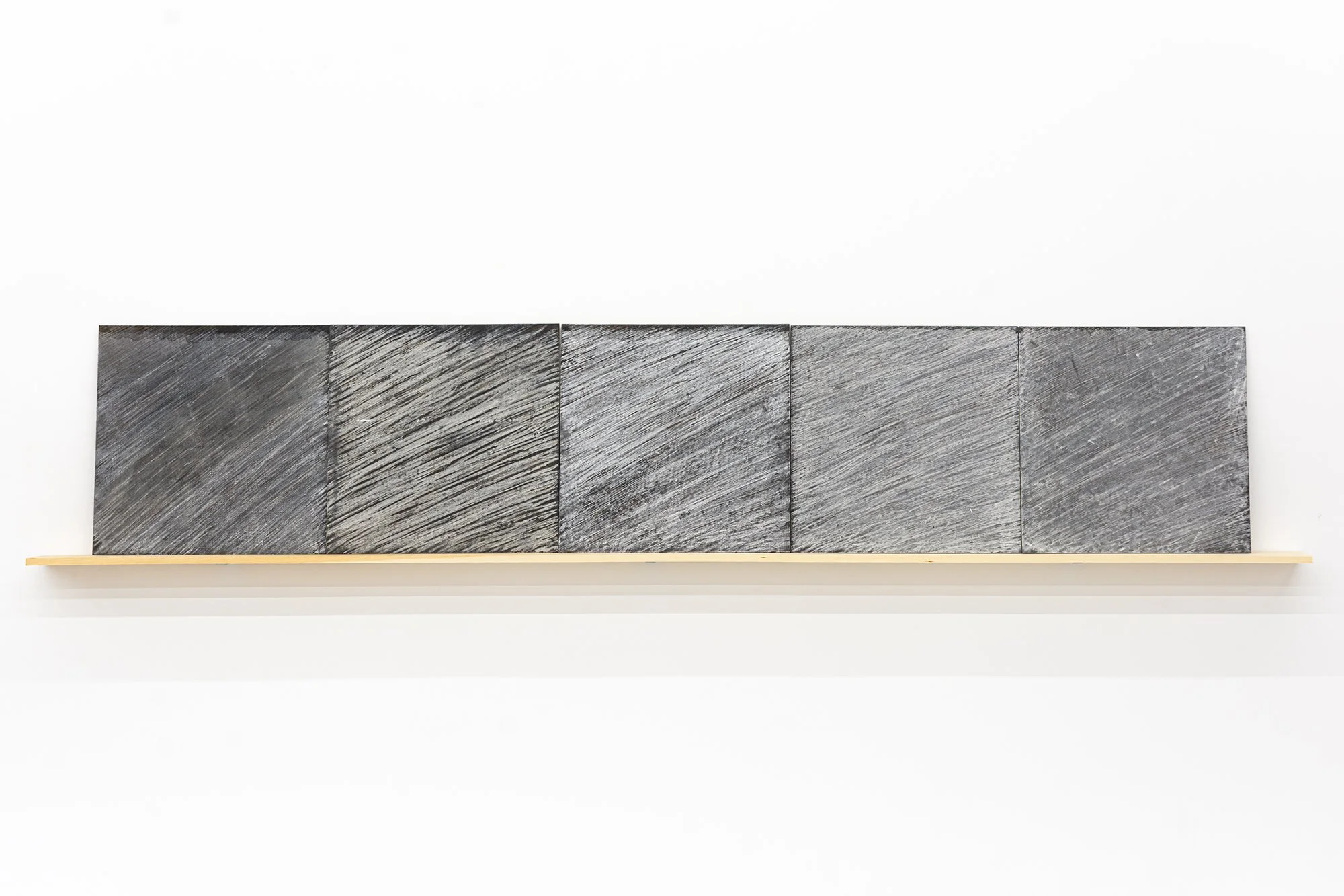 Michael Fernandes, Residue, a set of 5's, 2005. Blackboard and chalk. 24 inches x 10 ft.