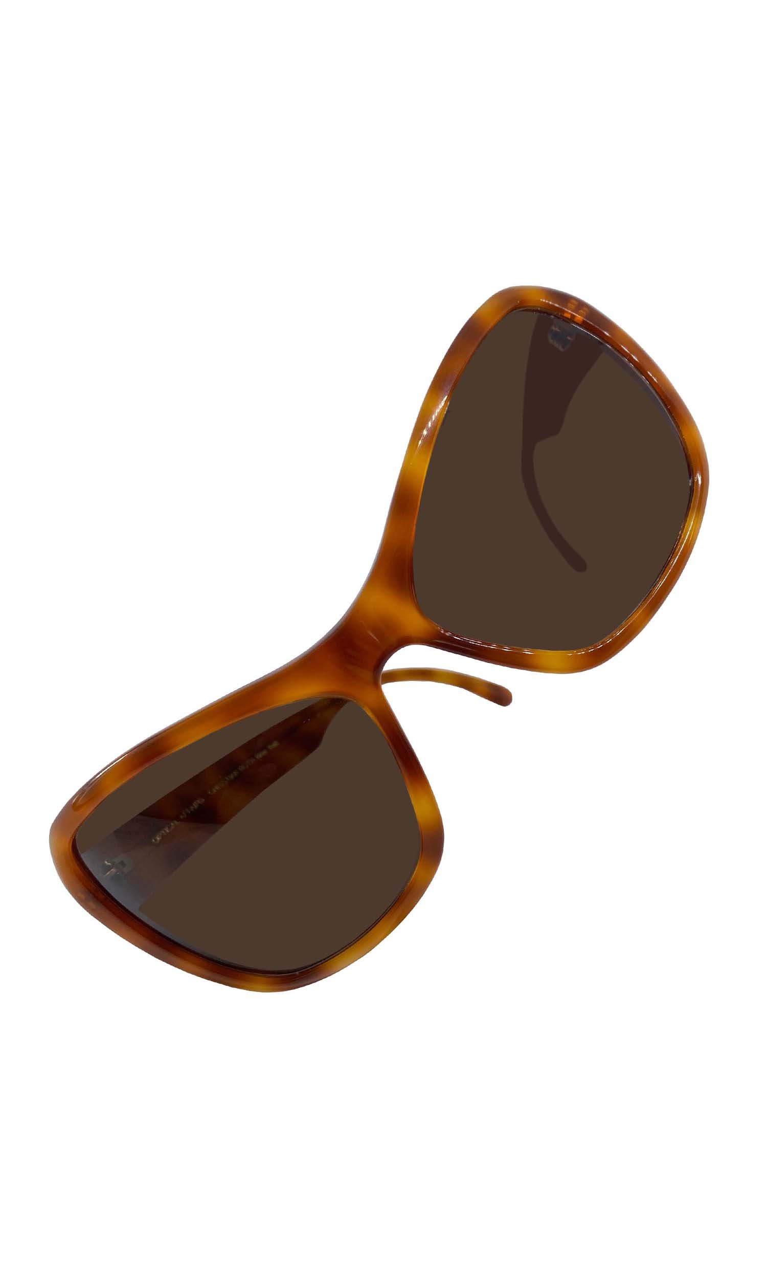 A dramatic cat eye sunglasses in amber color designed by Eric Domege and Christian Roth for Optical Affairs in the 1980's