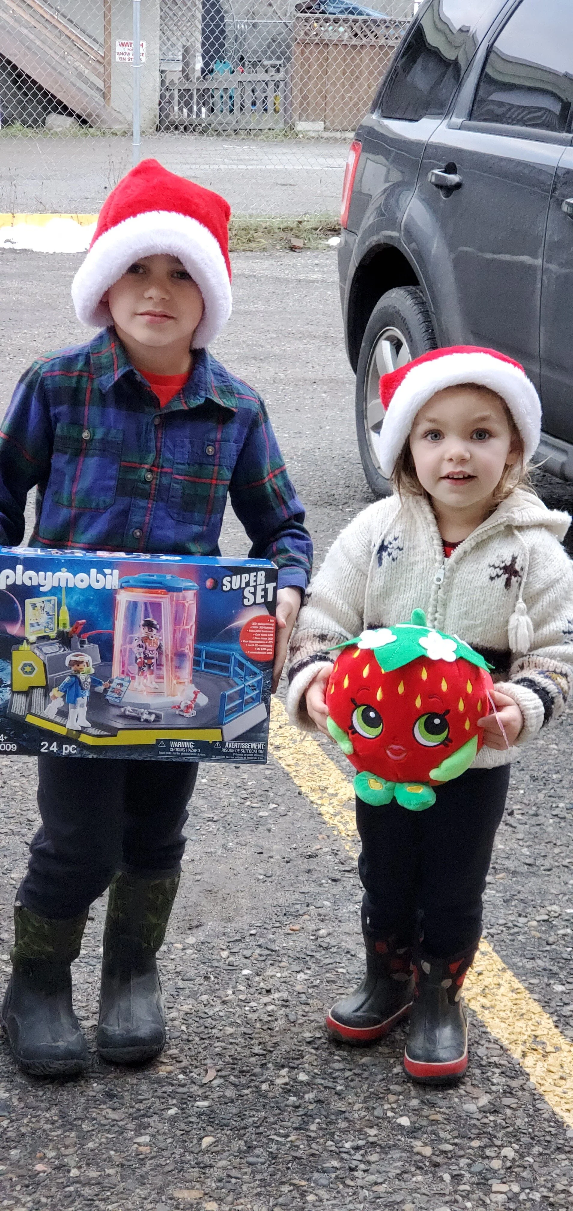 These cuties deliver some toys to us for kids who need a gift
