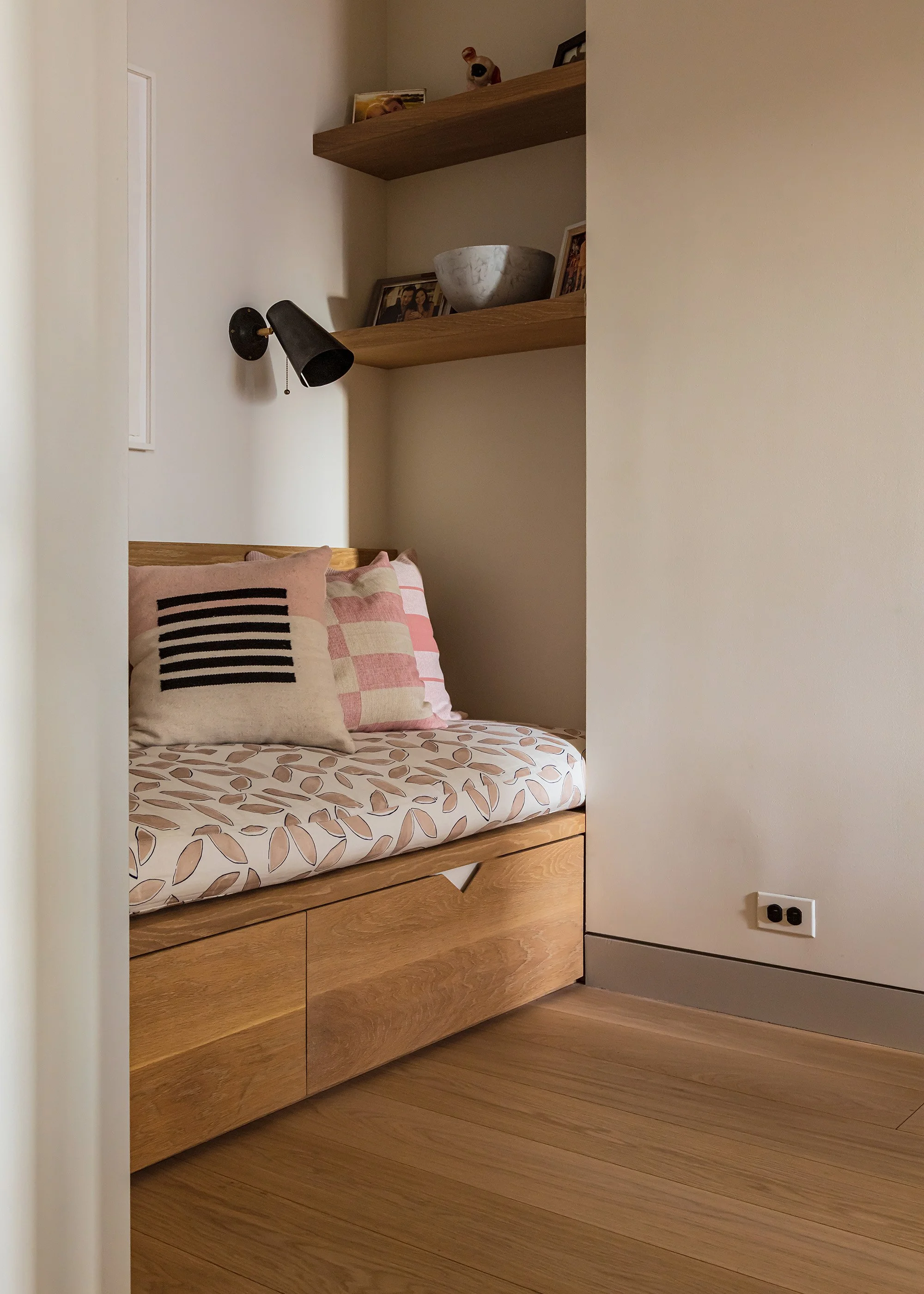 Playroom daybed with custom millwork and upholstered daybed