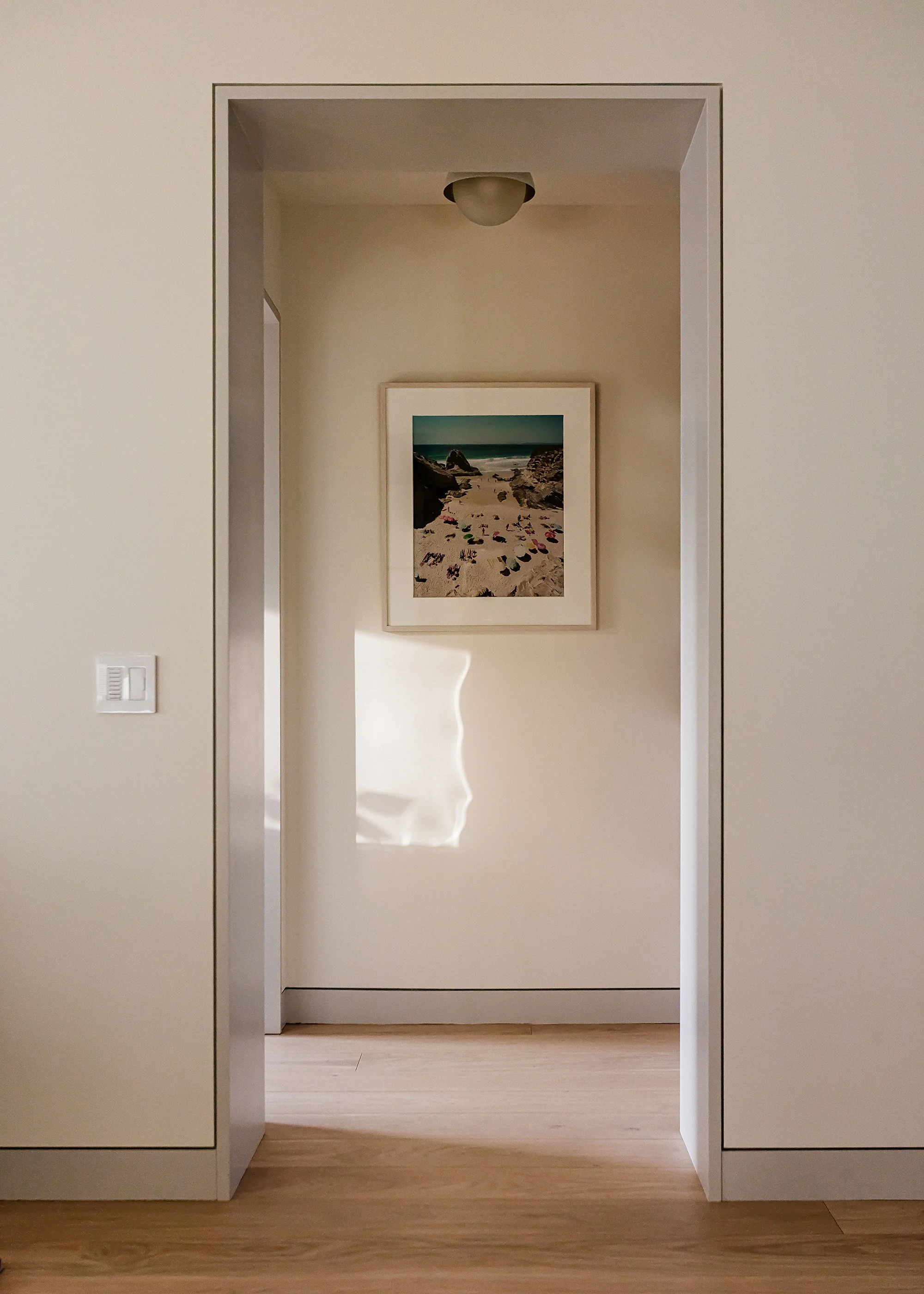 Flush modern baseboard and door casing with grey paint