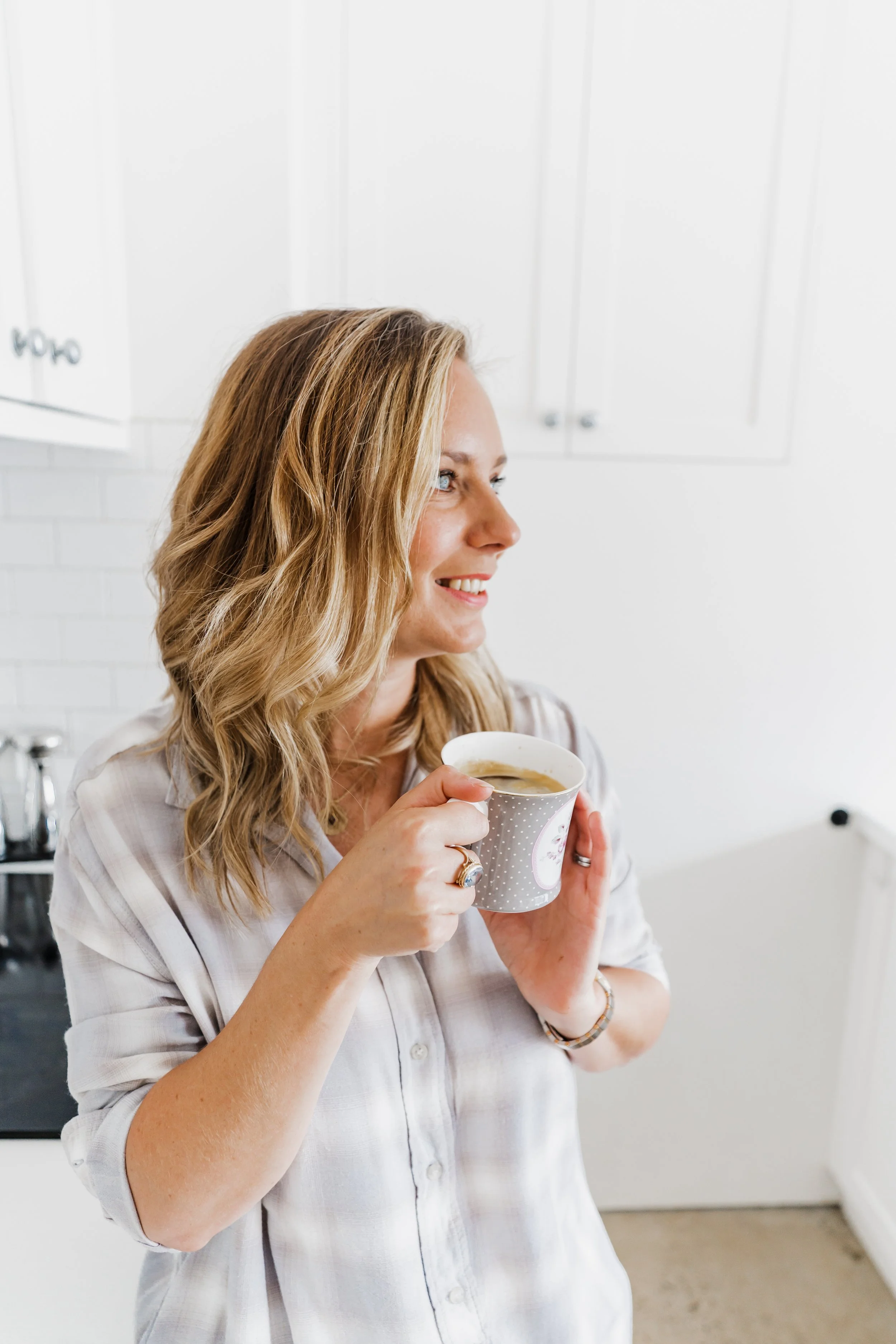 Katie lowndes sipping a coffee