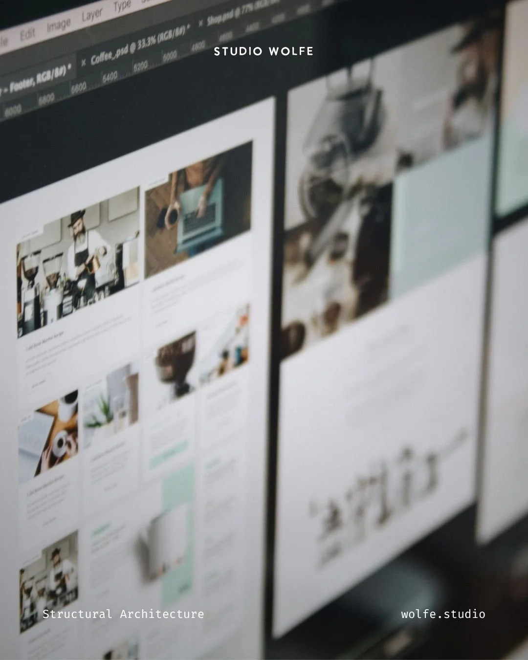 Close-up of design software showing website page layouts being reviewed across a desktop screen.