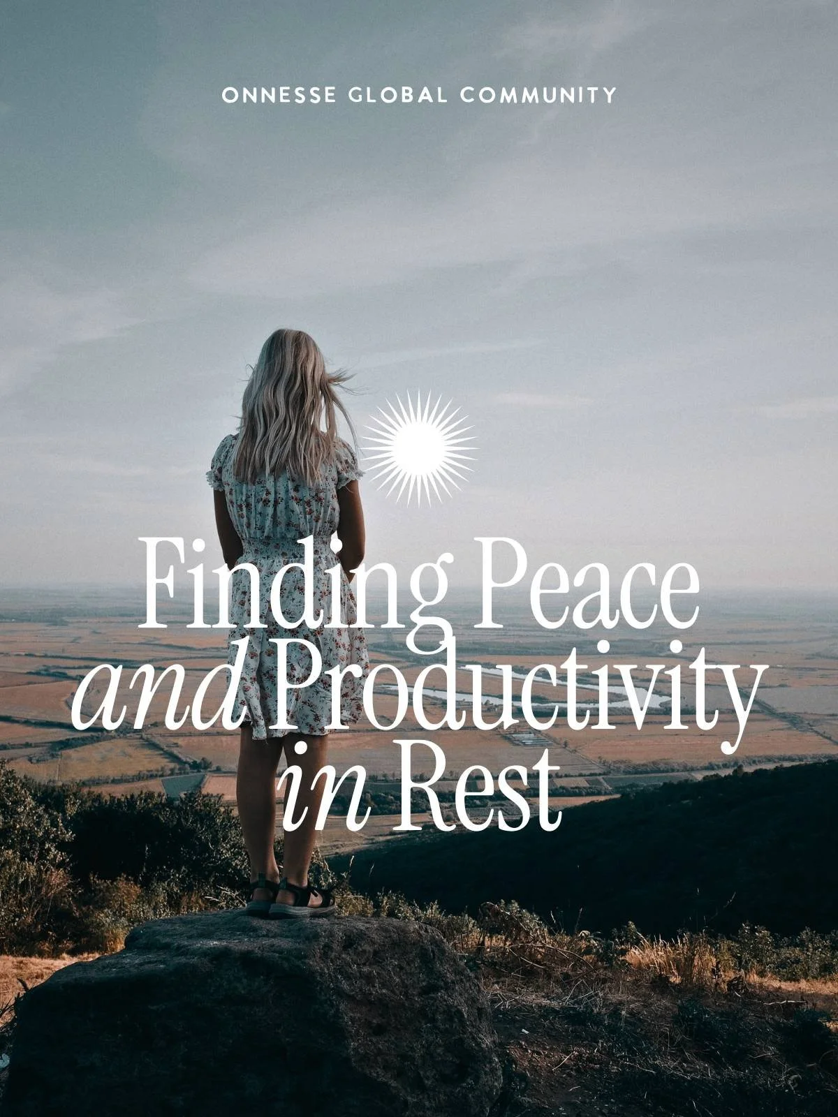 Blonde girl on hillside looking out across the landscape