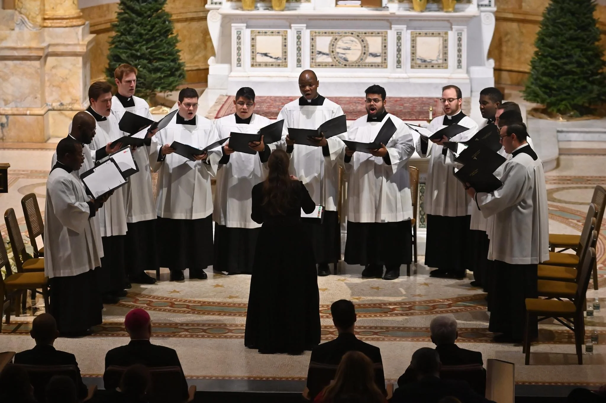 Sarah Jane Starcher Germani makes a guest appearance as conductor of the choir at Dunwoodie