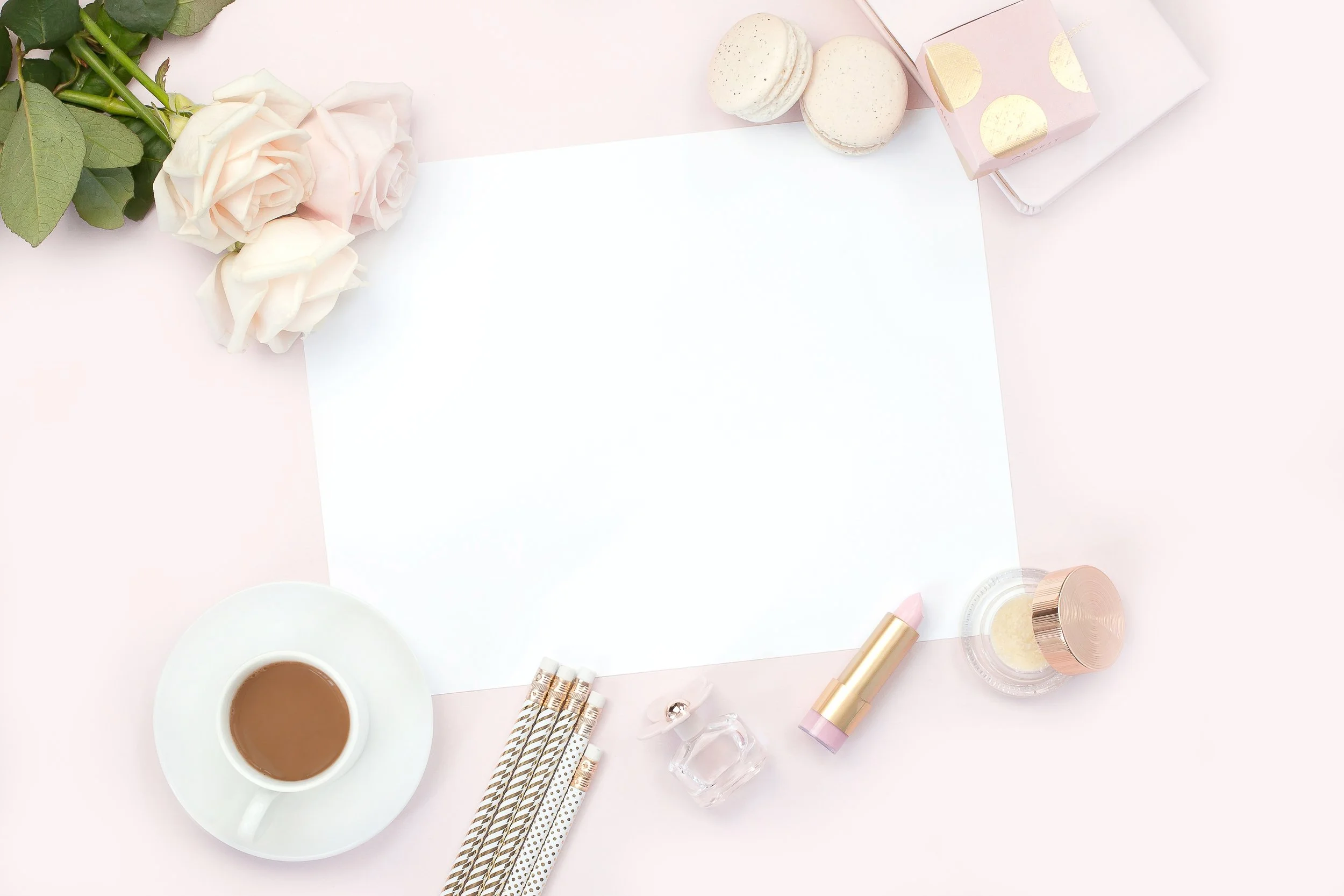 Pink desk flatly with roses and macarons