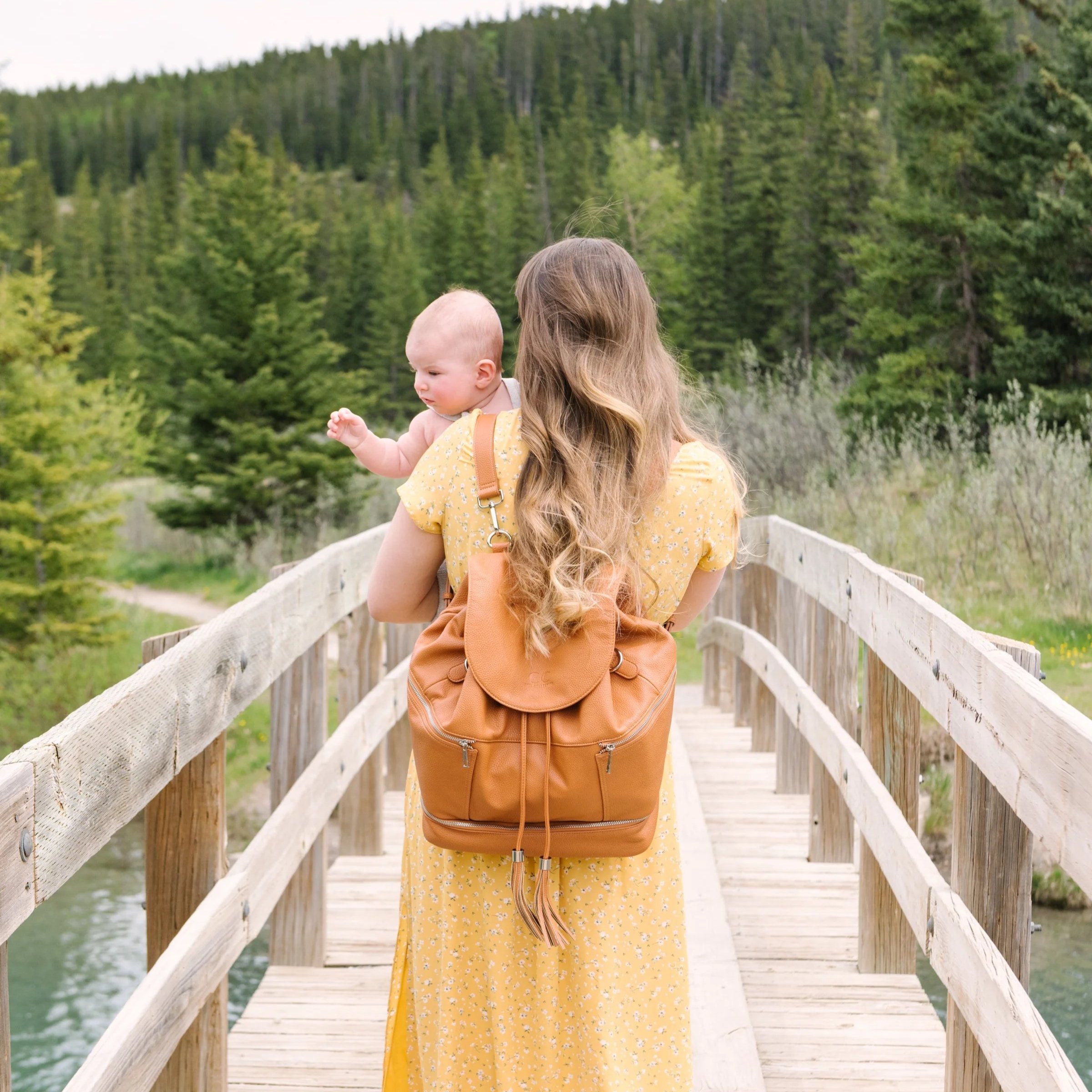 woman walks with baby choosing to do things now instead of putting them off