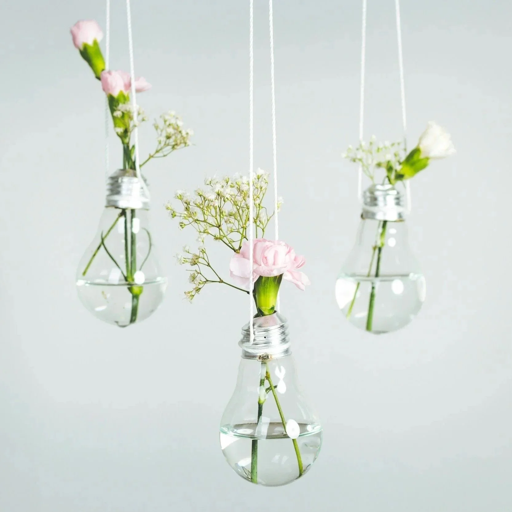 three vases of flowers that signify three goal areas for summer goal setting