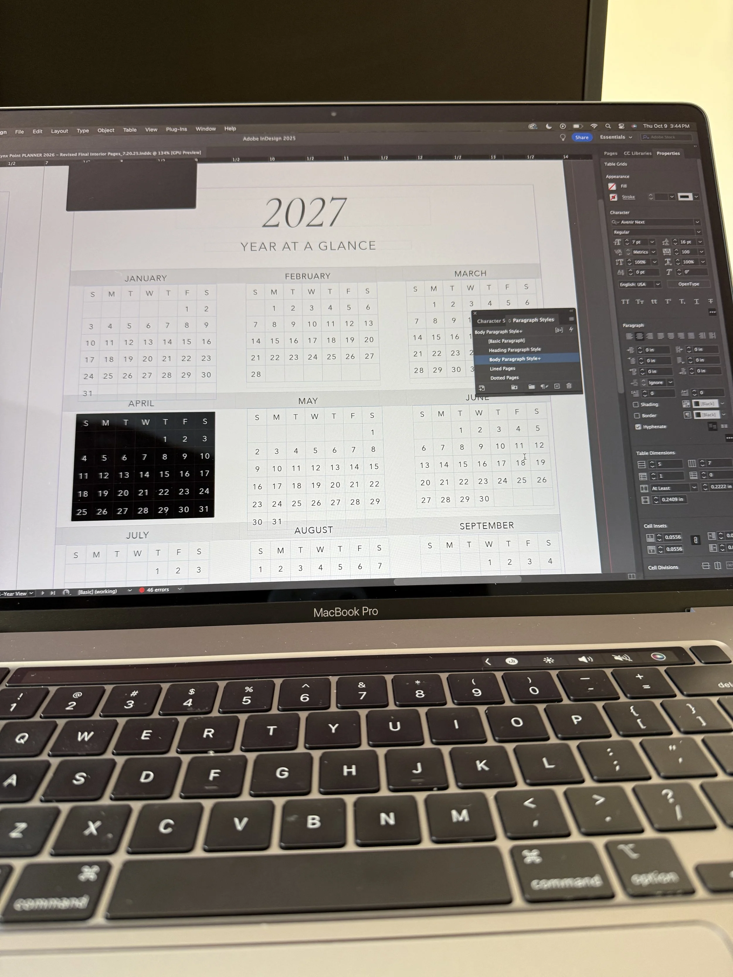 Photo of a computer screen running Indesign showing a page from the Lynx Point Planner