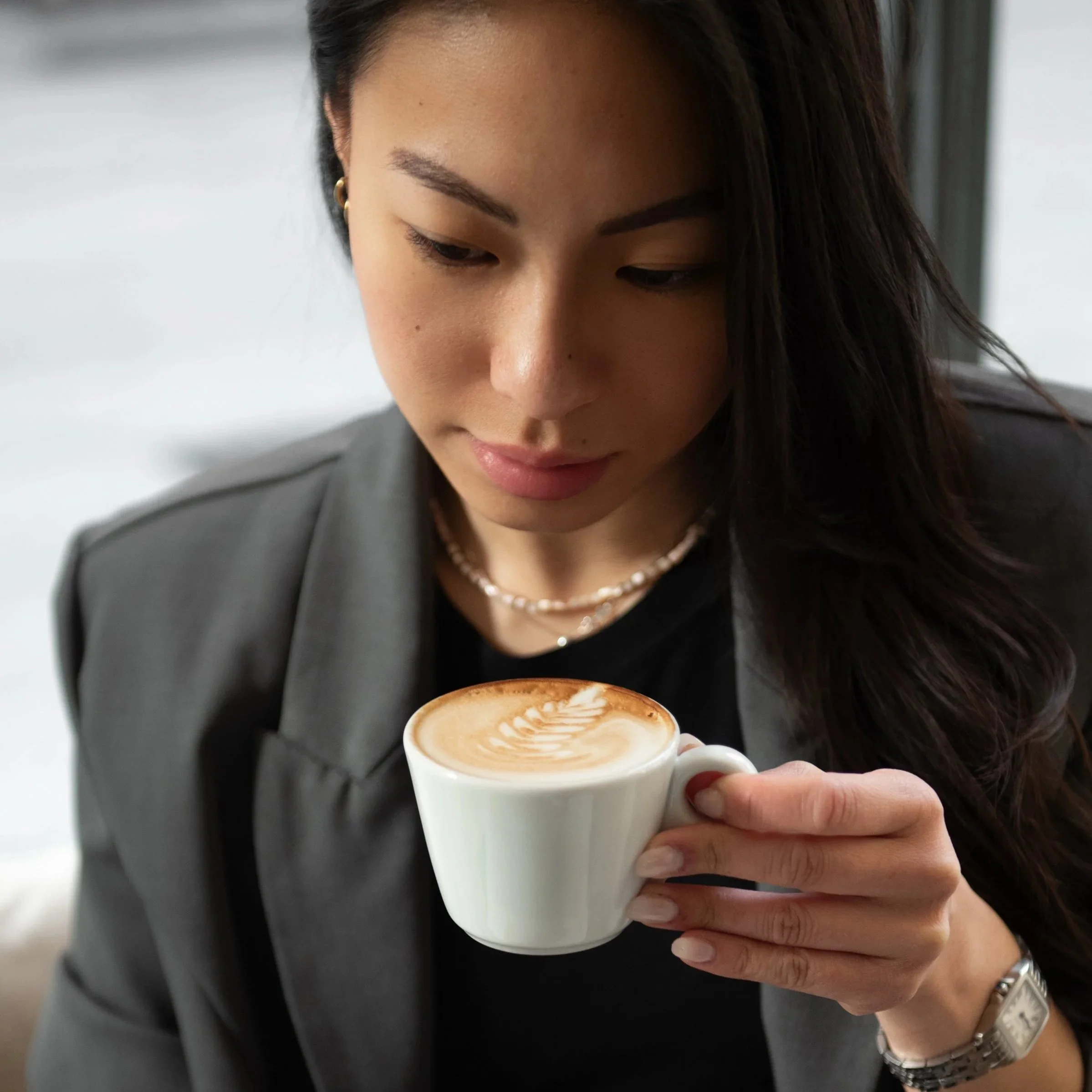 woman calmly drinking coffee after planning her schedule