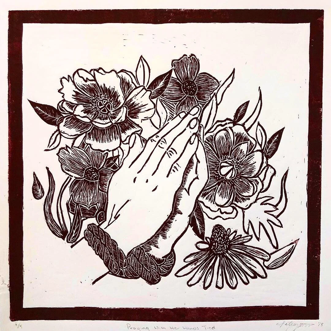 Praying with her hands tied.jpeg