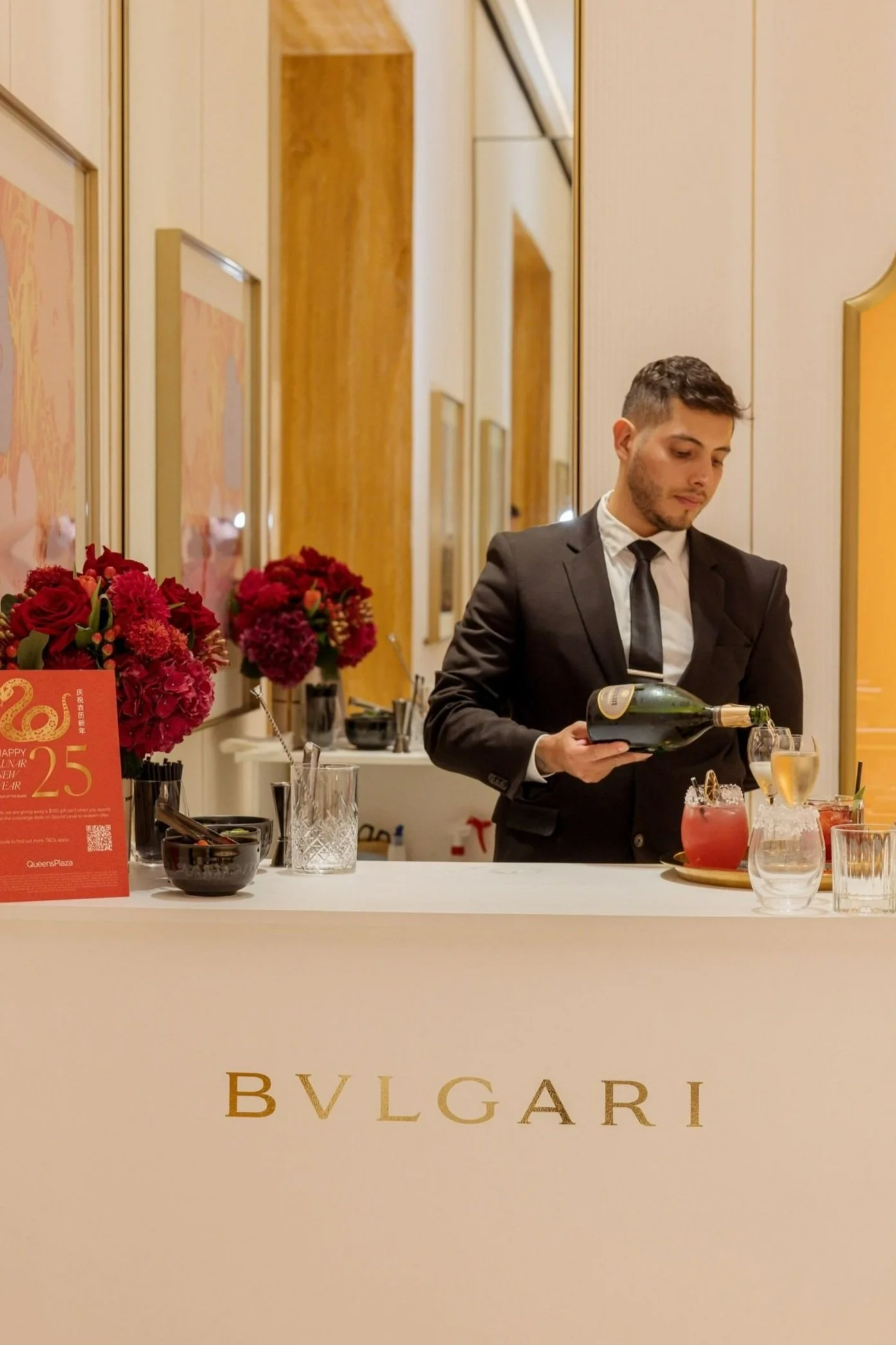 Bar tender pouring drinks at the Bvlgaari bar