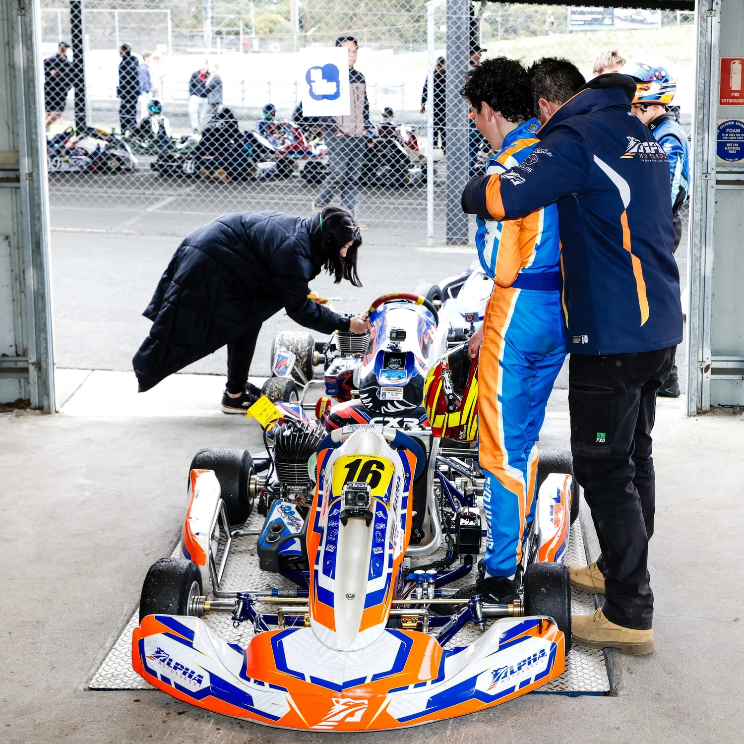 Driver and supporter working together at the kart