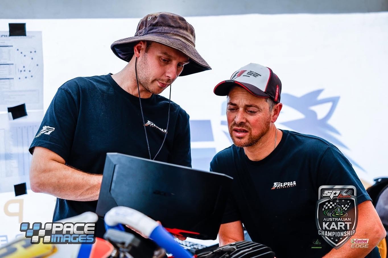 Parent and driver reviewing karting data together