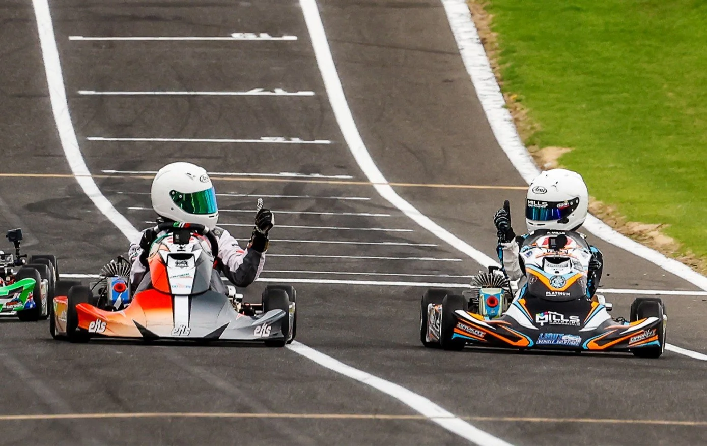 Two EKS drivers acknowledging each other after racing for the win