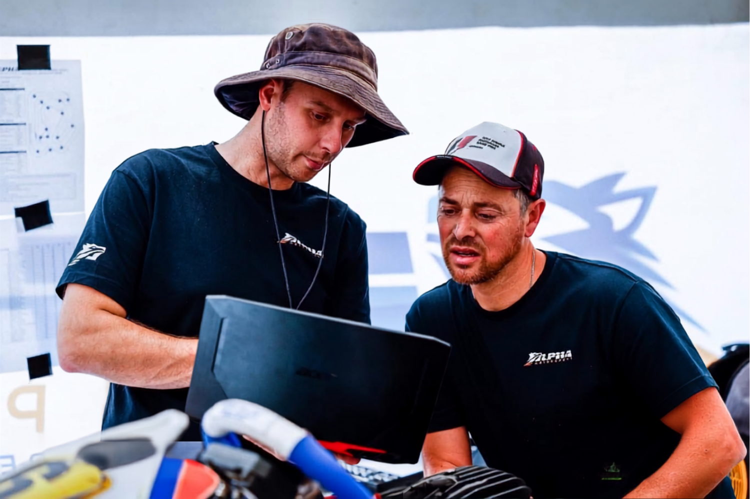 Parent and Coach reviewing karting data together