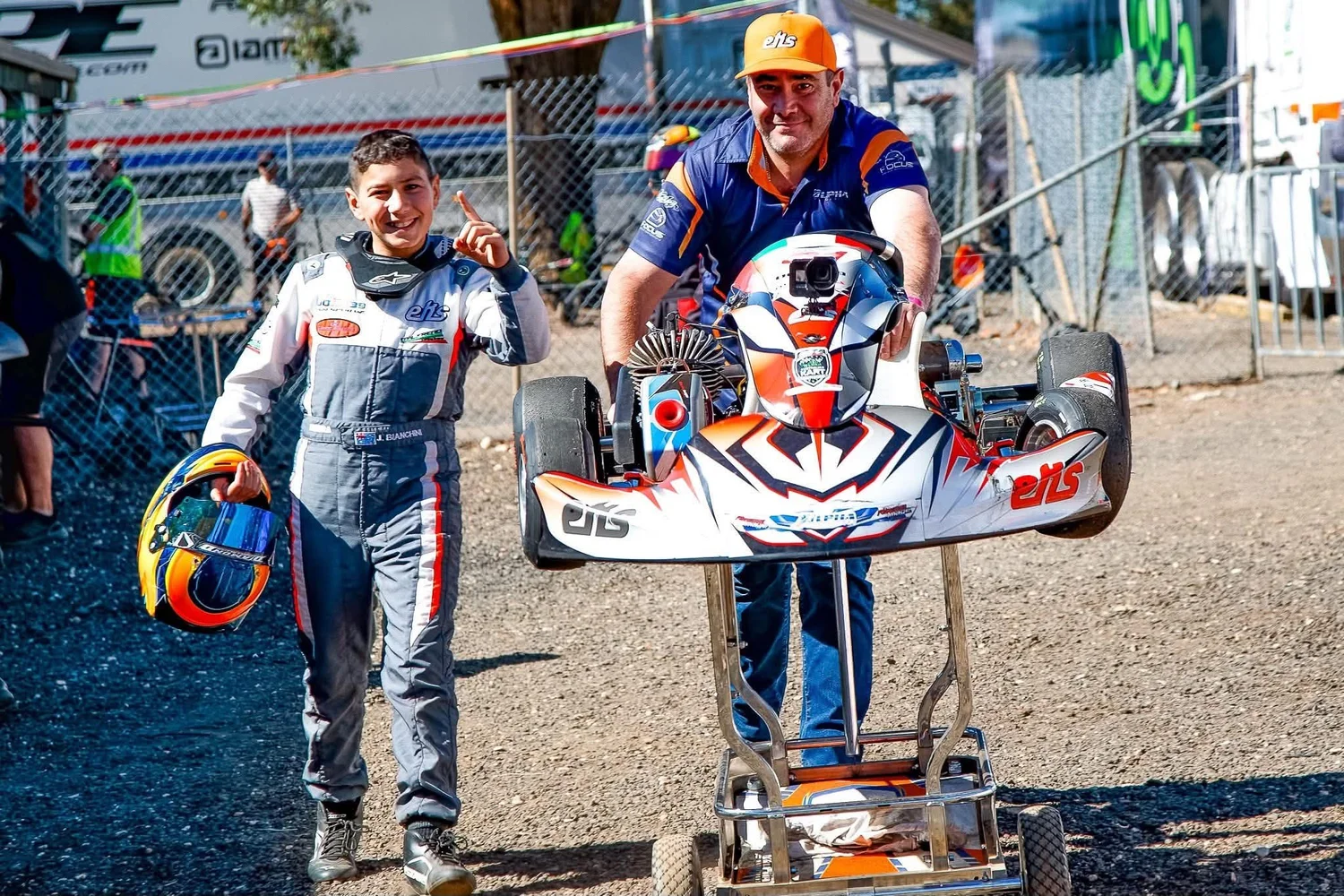 Alpha Motorsport drivers and mechanic celebrating pole position