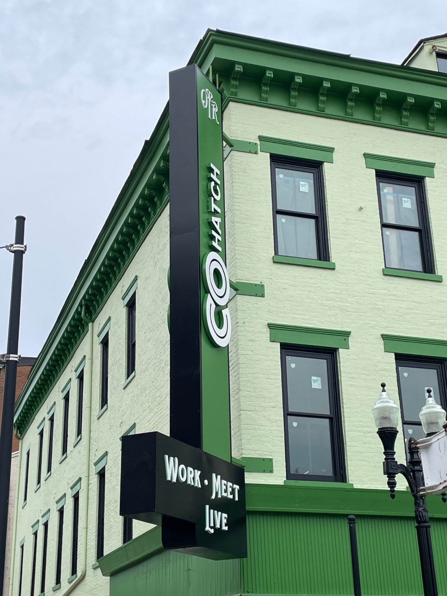 Green building with green sign reading "CoHatch" created by Brite Line Signs in Columbus, Ohio