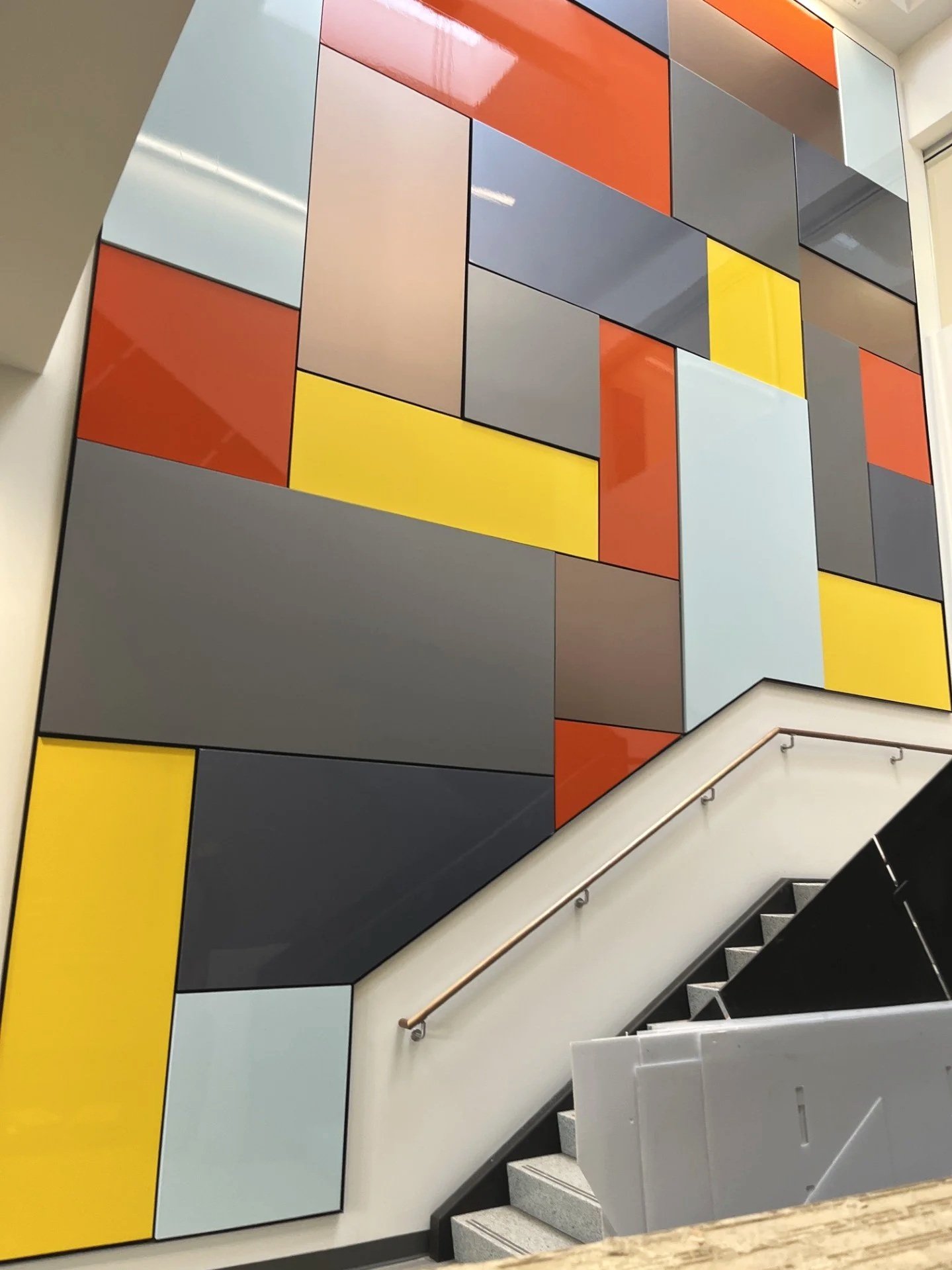 Multicolor rectangular vinyl panels along the wall of staircase, created by Brite Line Signs in Columbus, Ohio