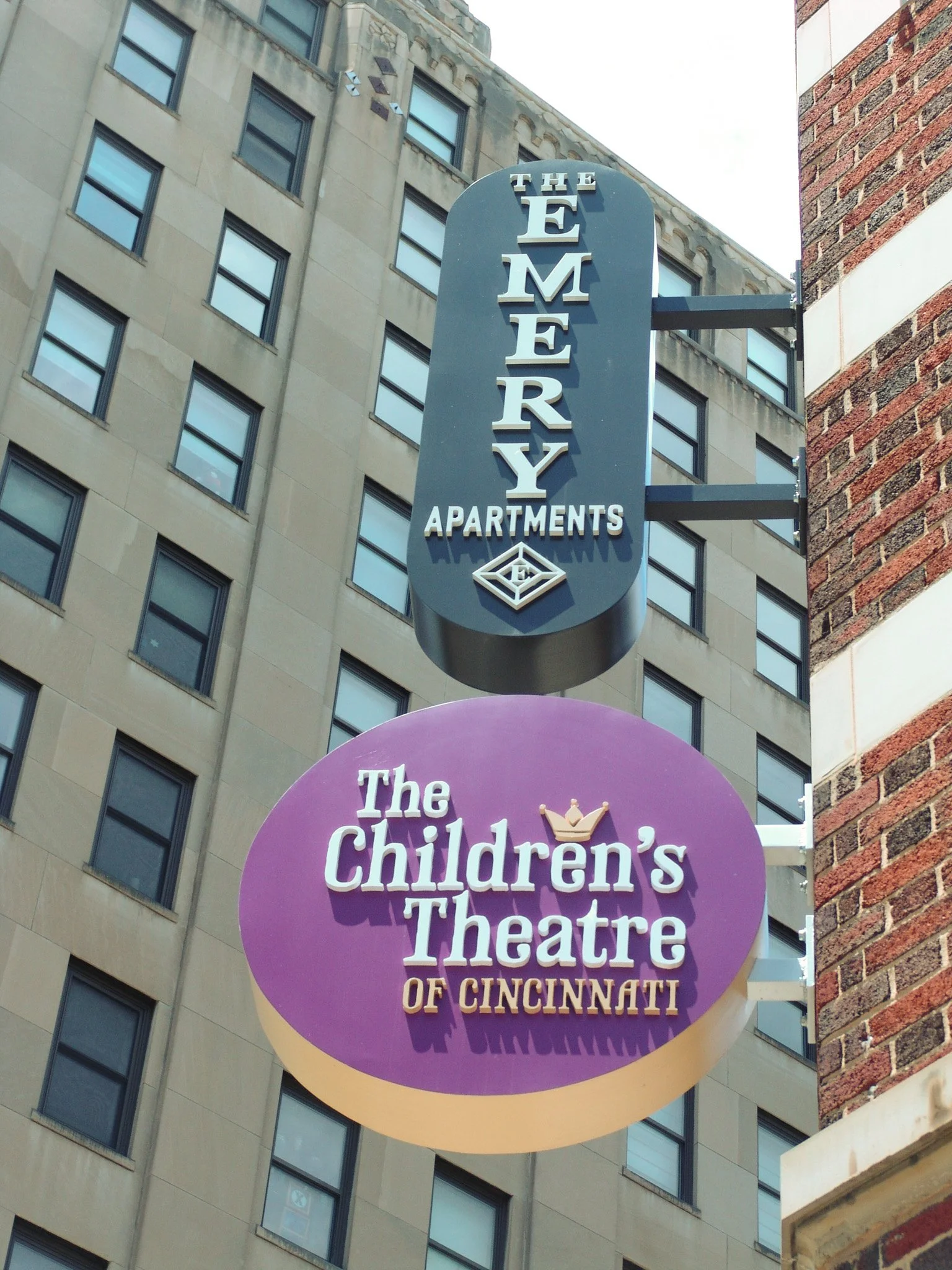 Small blade signs reading "The Emery Apartments" and "The Children's Theatre of Cincinnati" created by Brite Line Signs in Columbus, Ohio