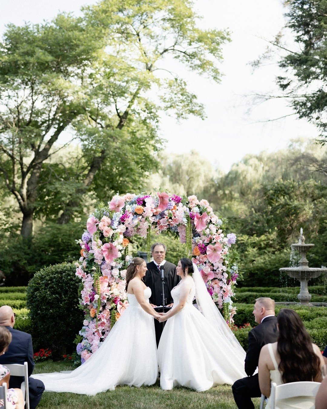 A ceremony moment designed to be unforgettable.
A full, rounded floral arch overflowing with color, luxury lilies, fluffy hydrangea, sculptural anthurium, and cascading amaranthus, creating movement, depth, and undeniable presence.

Where modern luxu