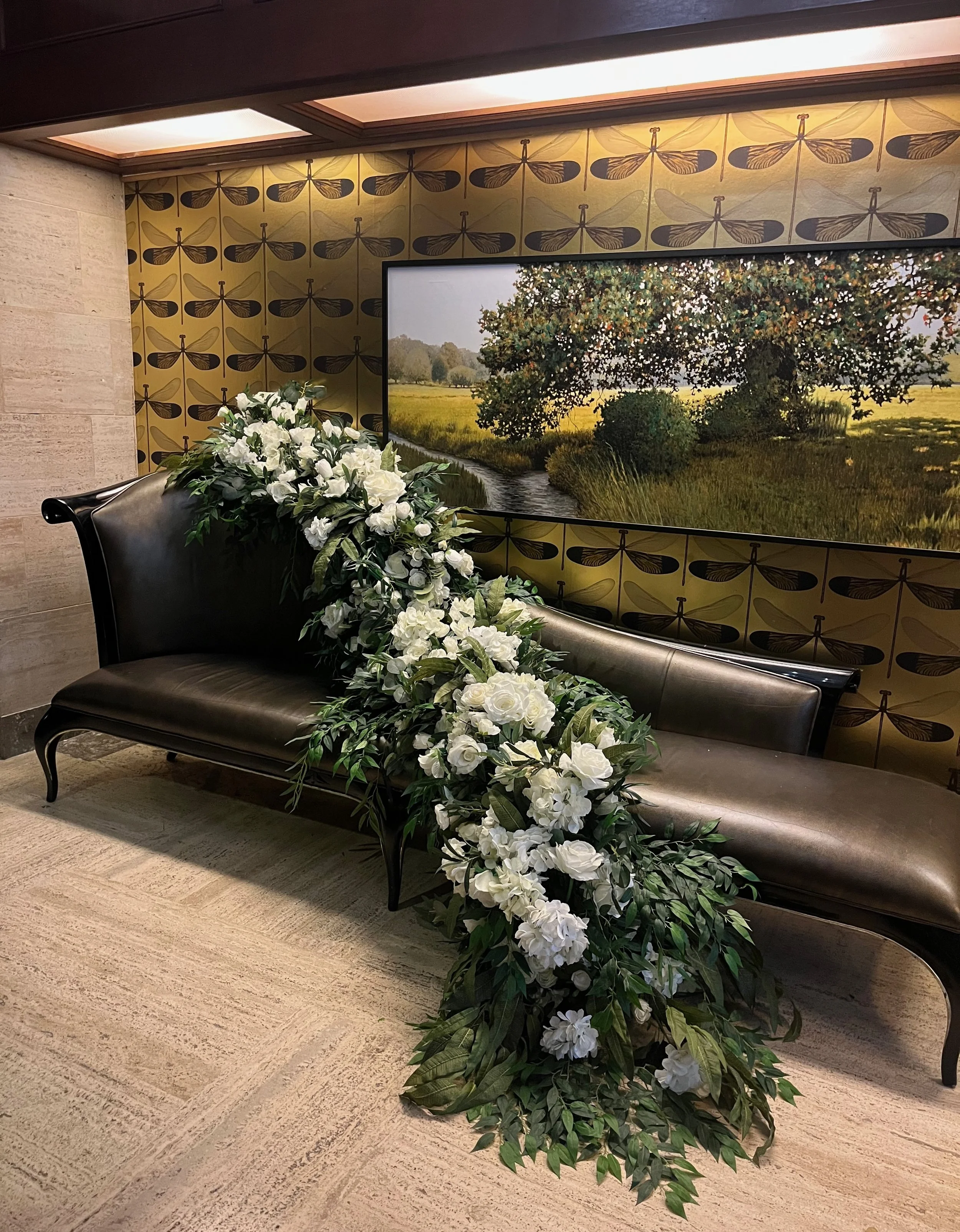 An arrangement of flowers resting on a chair