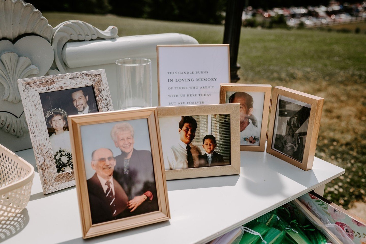 We loved all of these personalized wedding ceremony details! Perhaps our favorite was this beautiful memorial display on the antique buffet which also held fans and programs for guests to pick up on their way in. ⁠
⁠
#weddingvenue #summerwedding #gar