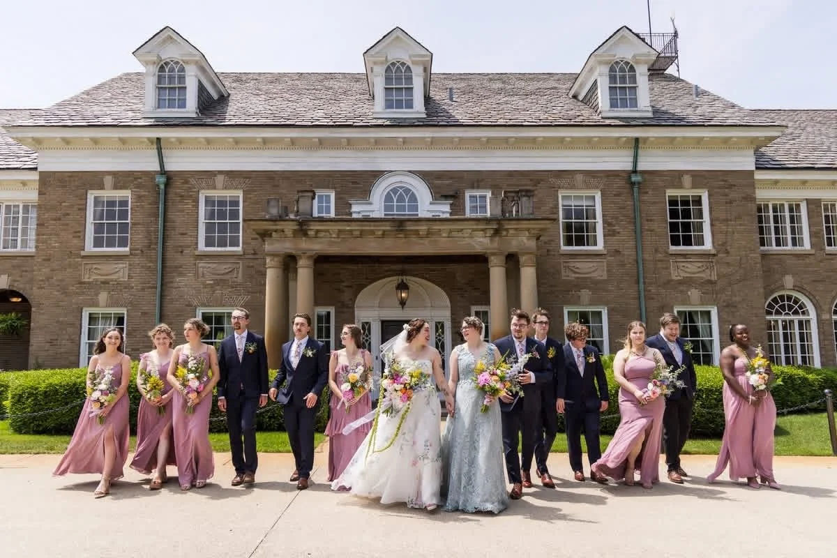 Wedding party photos in front of historic mansion Michigan wedding venue by Grand Rapids Photographer