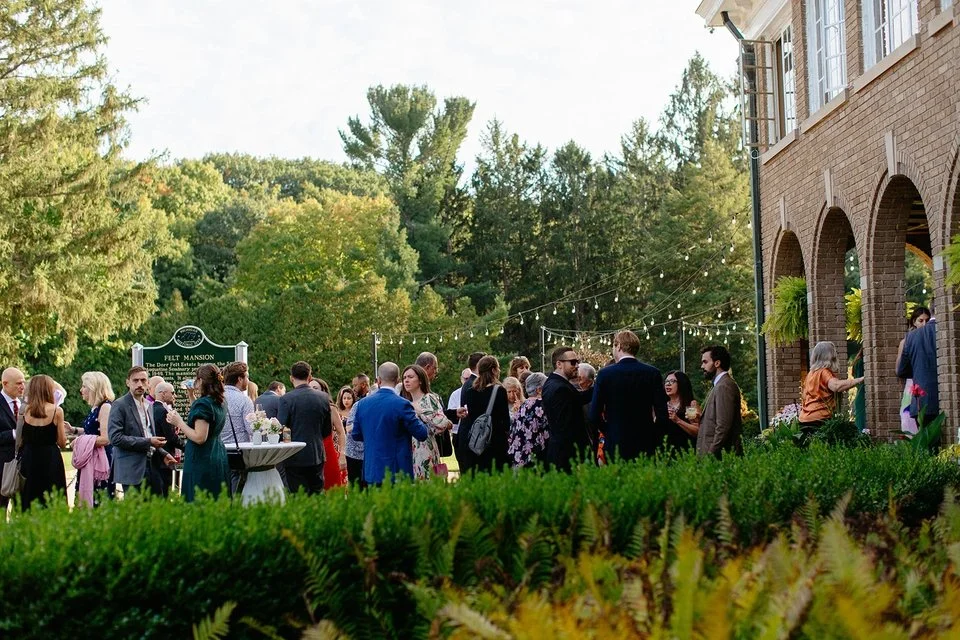 wedding guests enjoying cocktail hour at a historic michigan wedding venue
