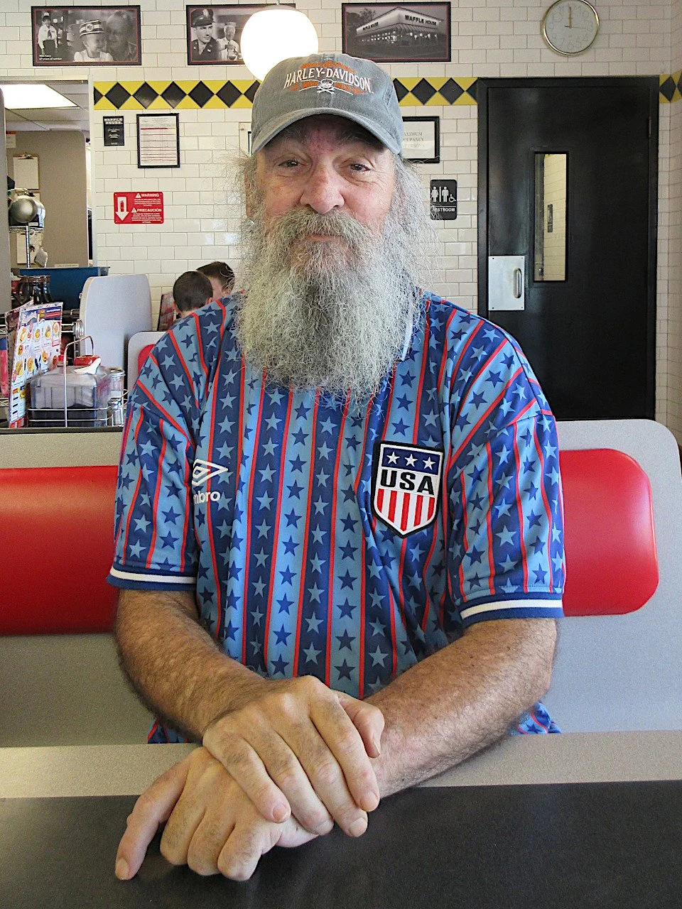 Matthew Trifecta — a brand new genuine Harley Davidson hat, a team USA soccer jersey, and Waffle House — four eggs sunny-side up, hash browns, and raisin bread toast with butter. July 2026