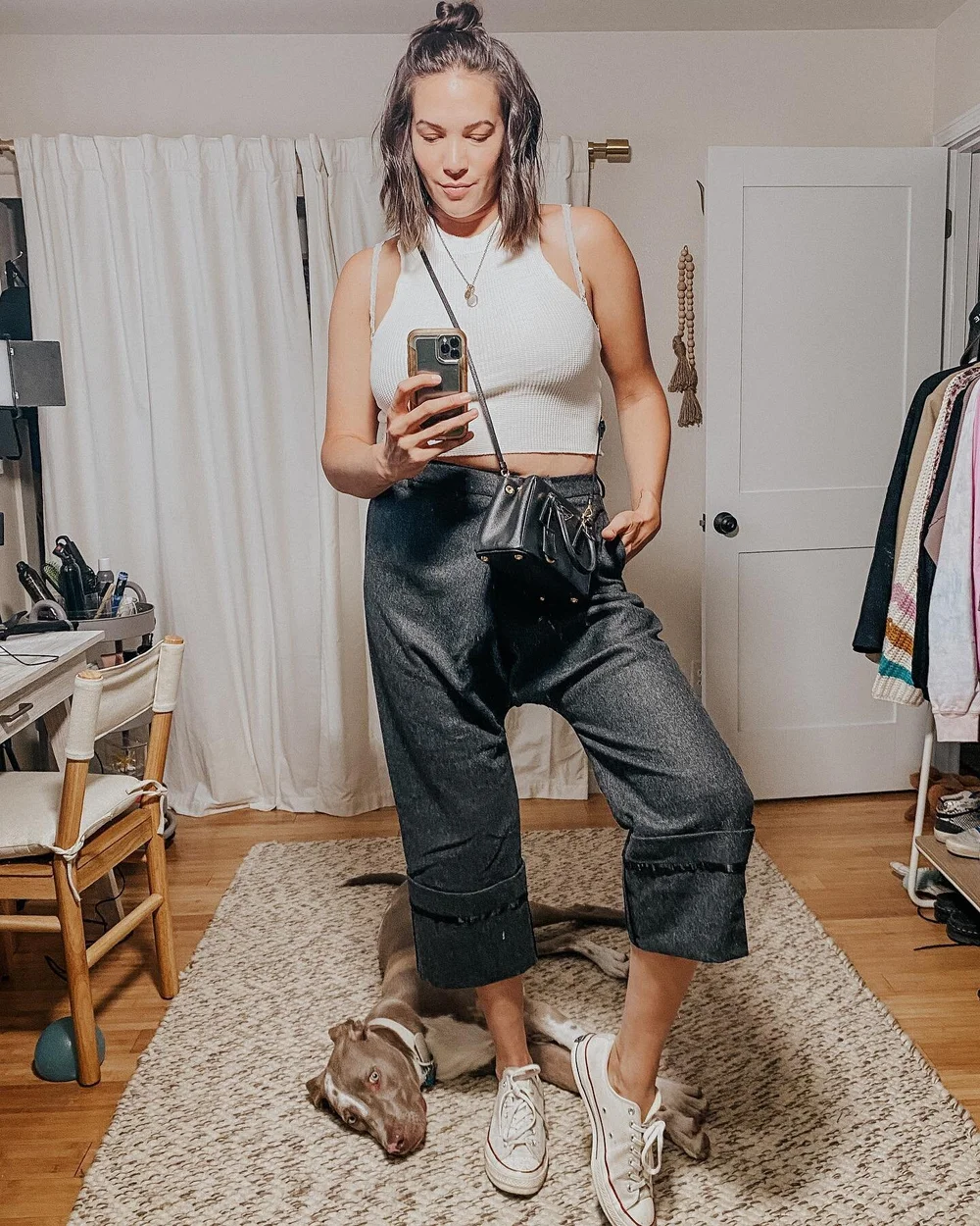 &ldquo;Mom. Are you done yet?&rdquo; 
.
.
Nothing like a selfie with the little angel baby 😇🐶 @thepocketdogg 
.
.
Top: @urbanoutfitters Bottoms: @r13 Bag: @prada @hotboxbetty Shoes: @converse
.
.
#dogsofinstagram #dogs #ootd #neutralstyle #r13 #urb