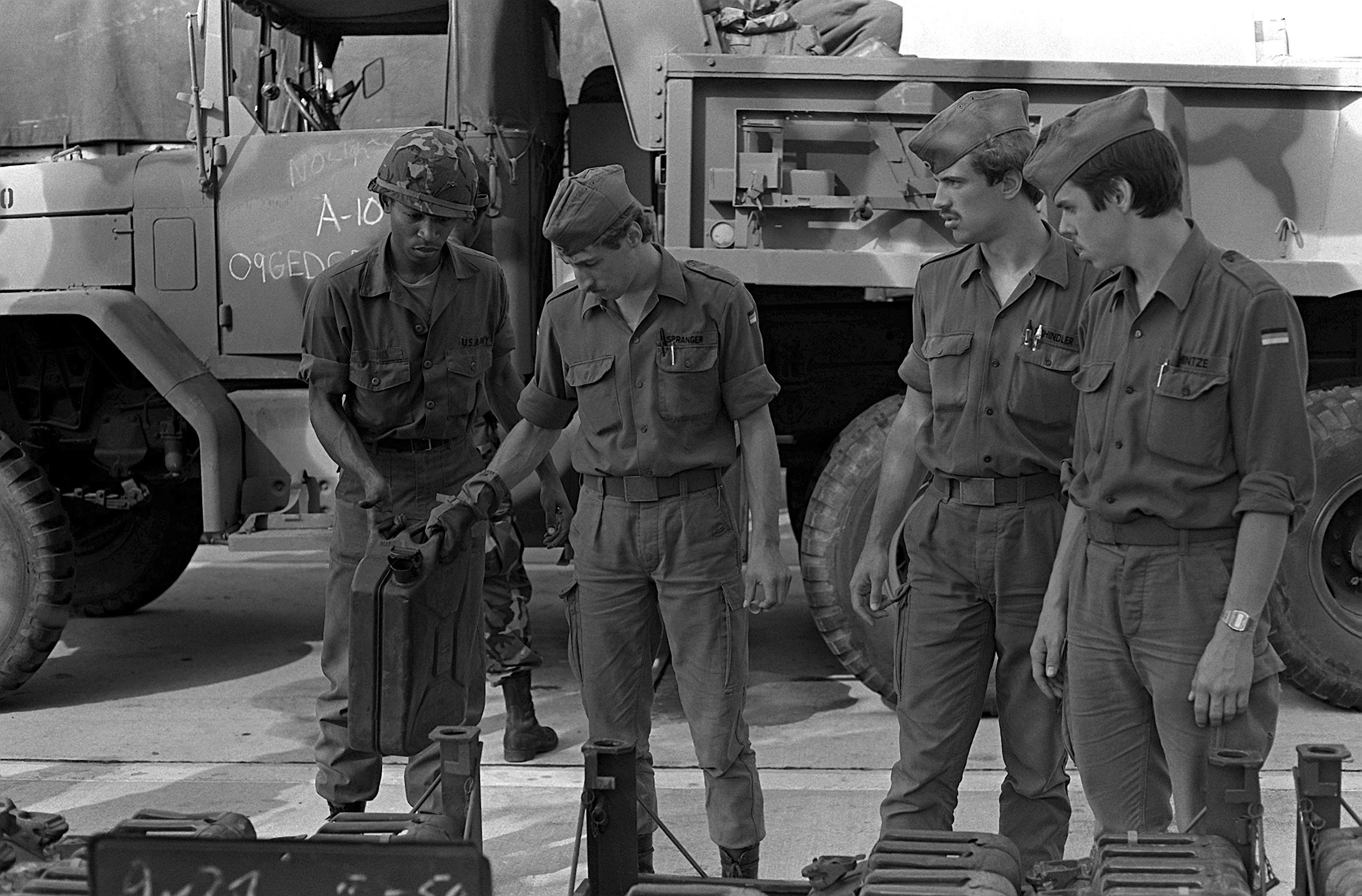 DA-SN-83-08446_German_troops_assist_an_U._S._soldier_in_refilling_gas_cans_with_diesel_fuel_1982.jpeg