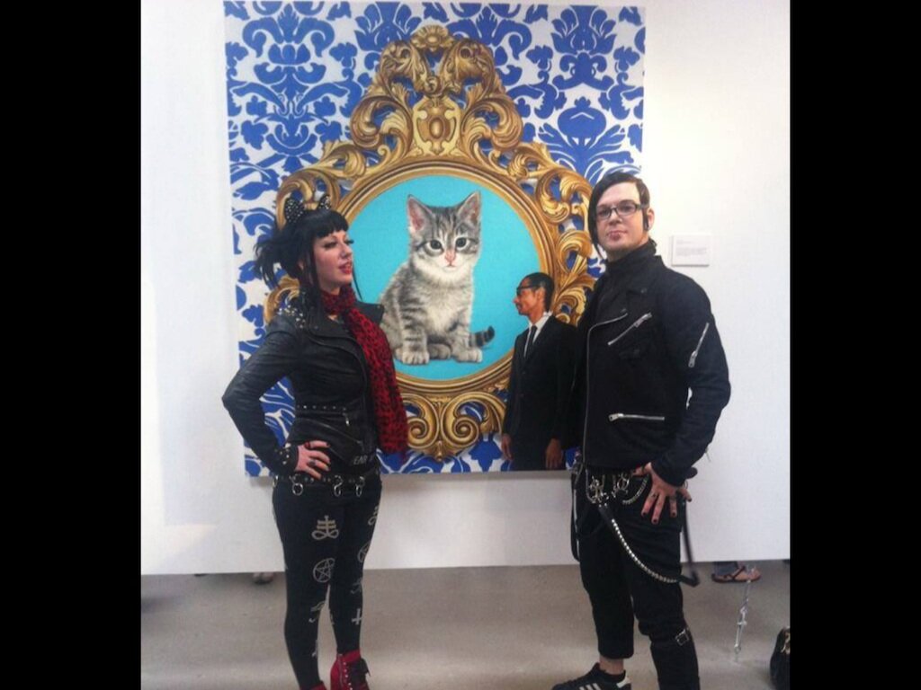 Art patrons with Marc Dennis hyper-realist work, 2014