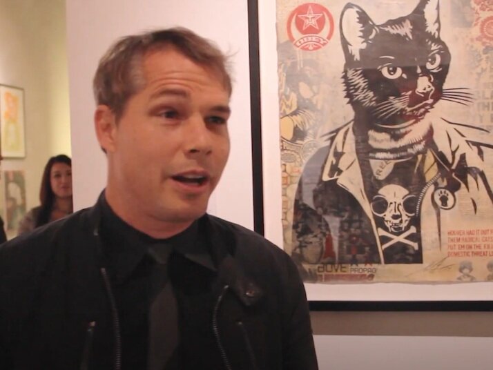 Artist Shepard Fairey with his work, “Radical Cat” at Cat Art Show 2014