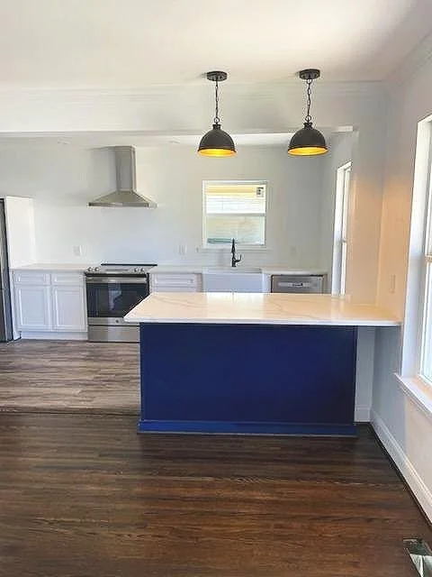 Total kitchen remodel- this was a very difficult designed kitchen before we redid it. We took down walls and moved the back door to make it bigger and give it a more open space.
