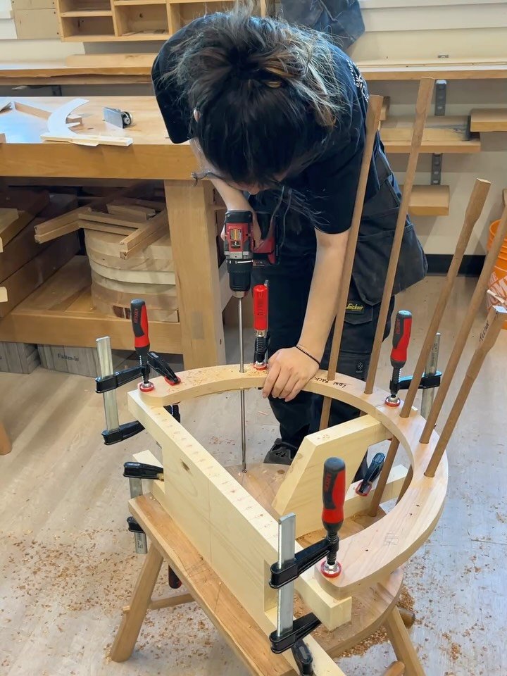 Day 3 chair-making. Drilling the arms, with help from a spotter. Final measuring and fitting stretchers for the legs. Trimming the feet for stability.